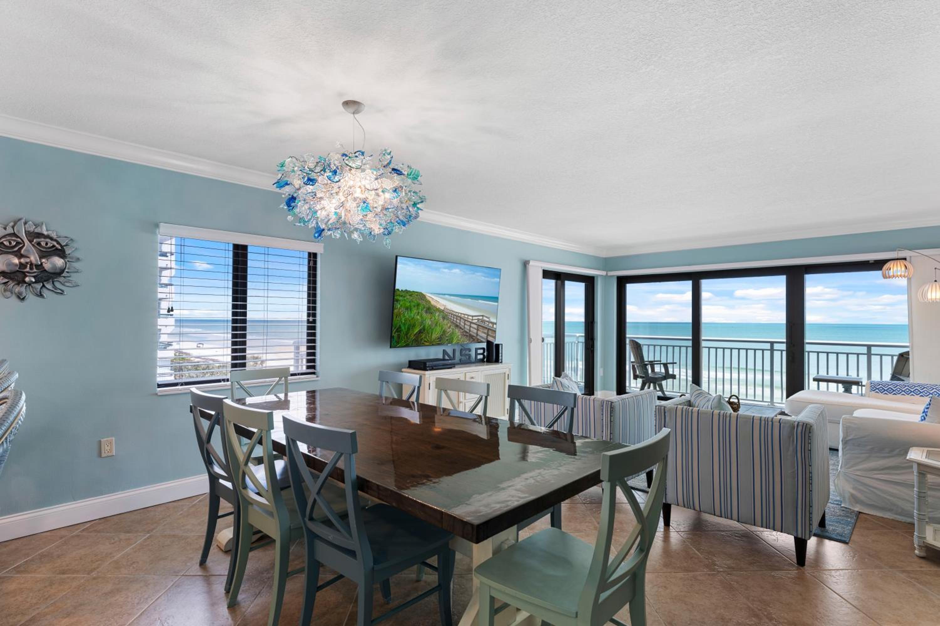 Updated direct oceanfront corner with a wrap-around balcony, heated pool and beach access
