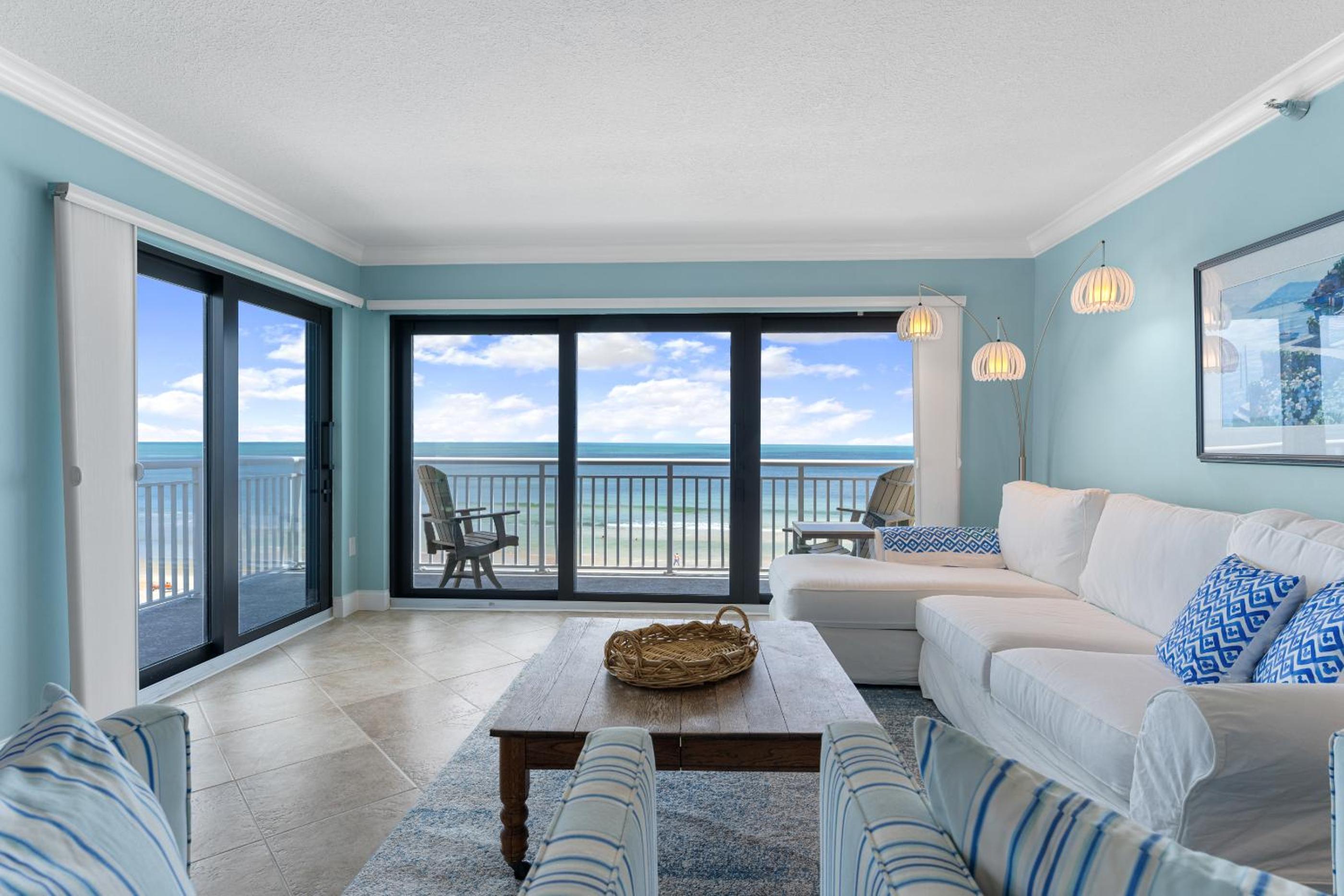 Updated direct oceanfront corner with a wrap-around balcony, heated pool and beach access