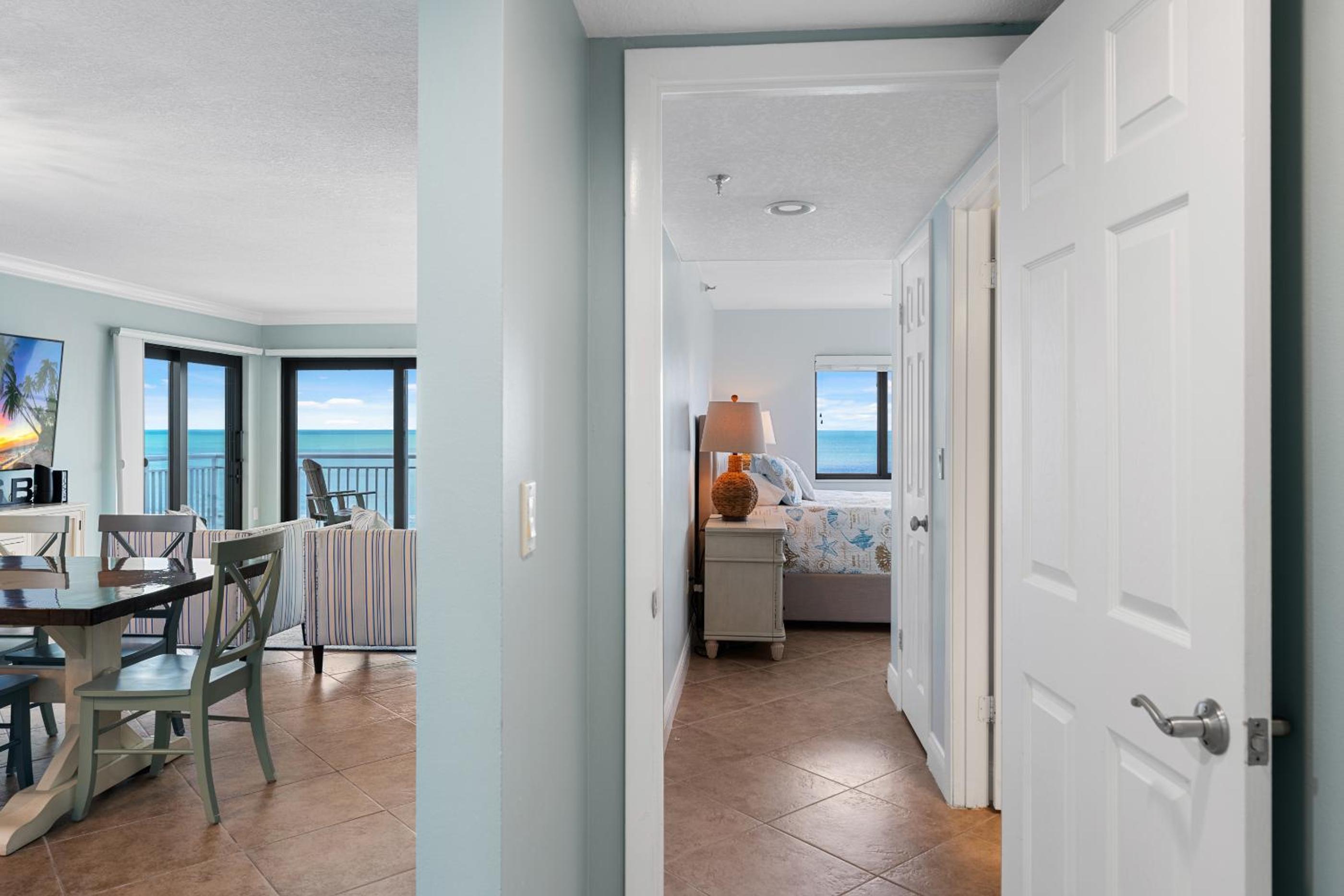 Updated direct oceanfront corner with a wrap-around balcony, heated pool and beach access
