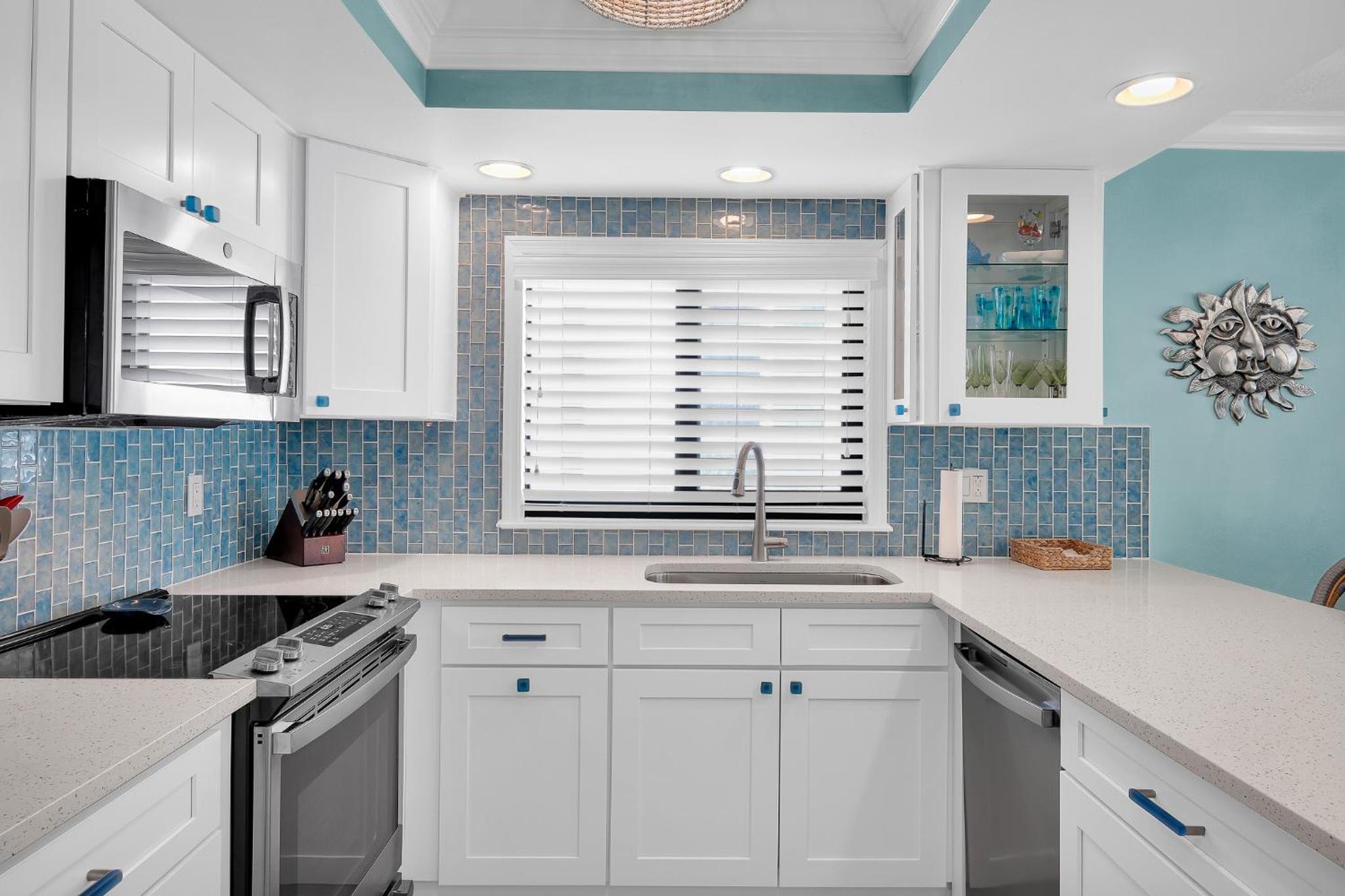 Updated direct oceanfront corner with a wrap-around balcony, heated pool and beach access