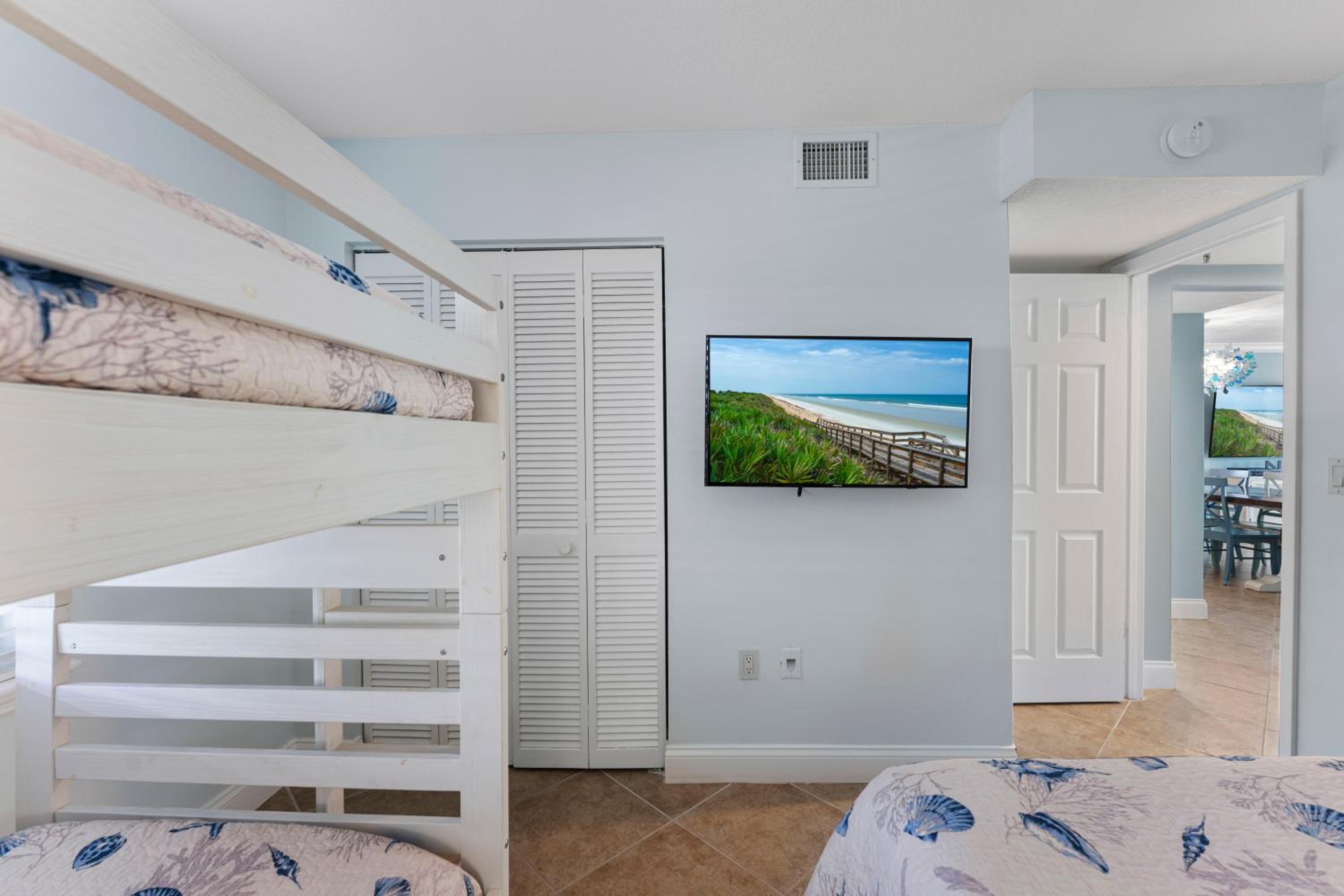 Updated direct oceanfront corner with a wrap-around balcony, heated pool and beach access