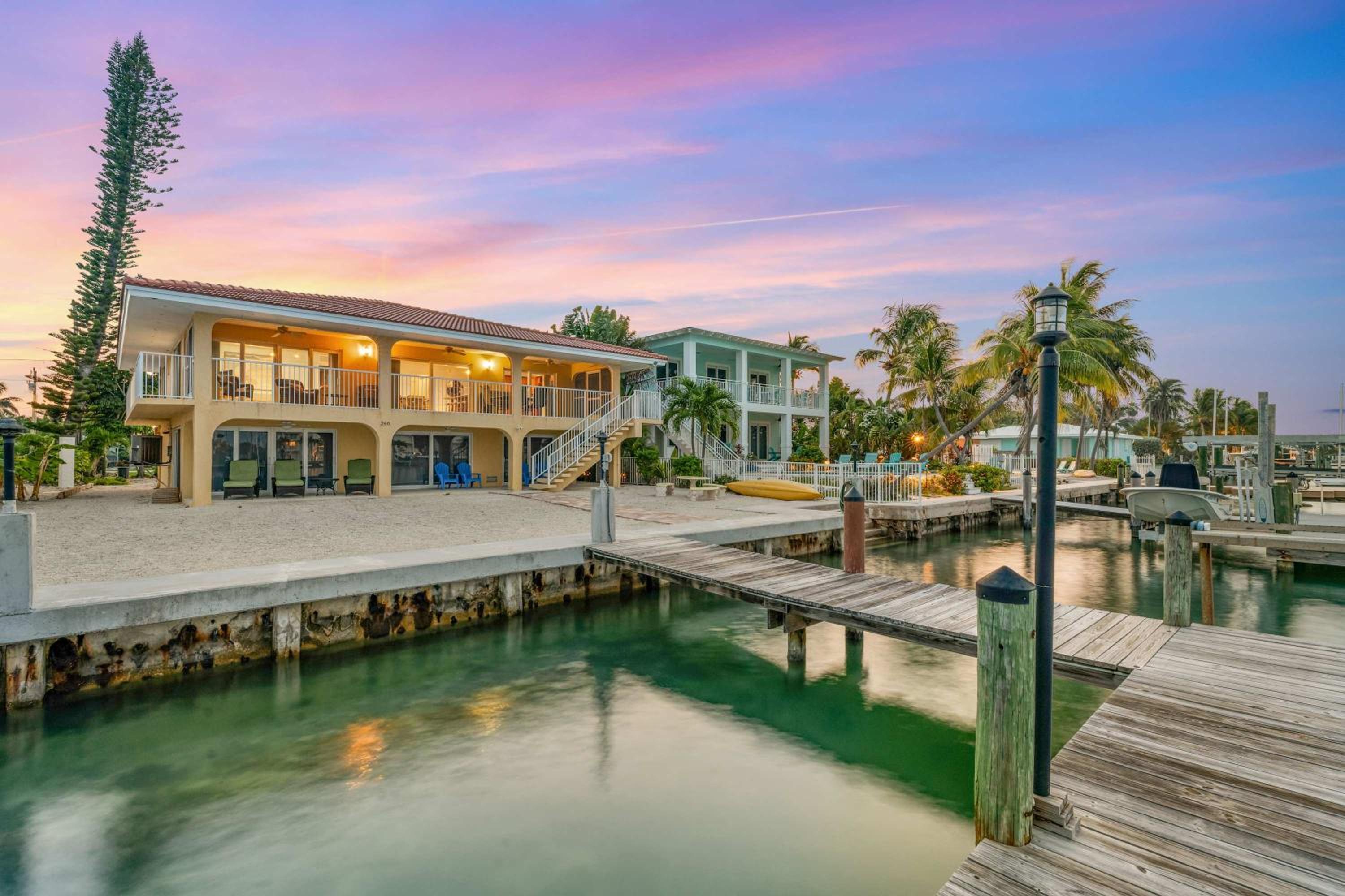 Sunset Harbor Waterfront Villa with Dock Cabana Club