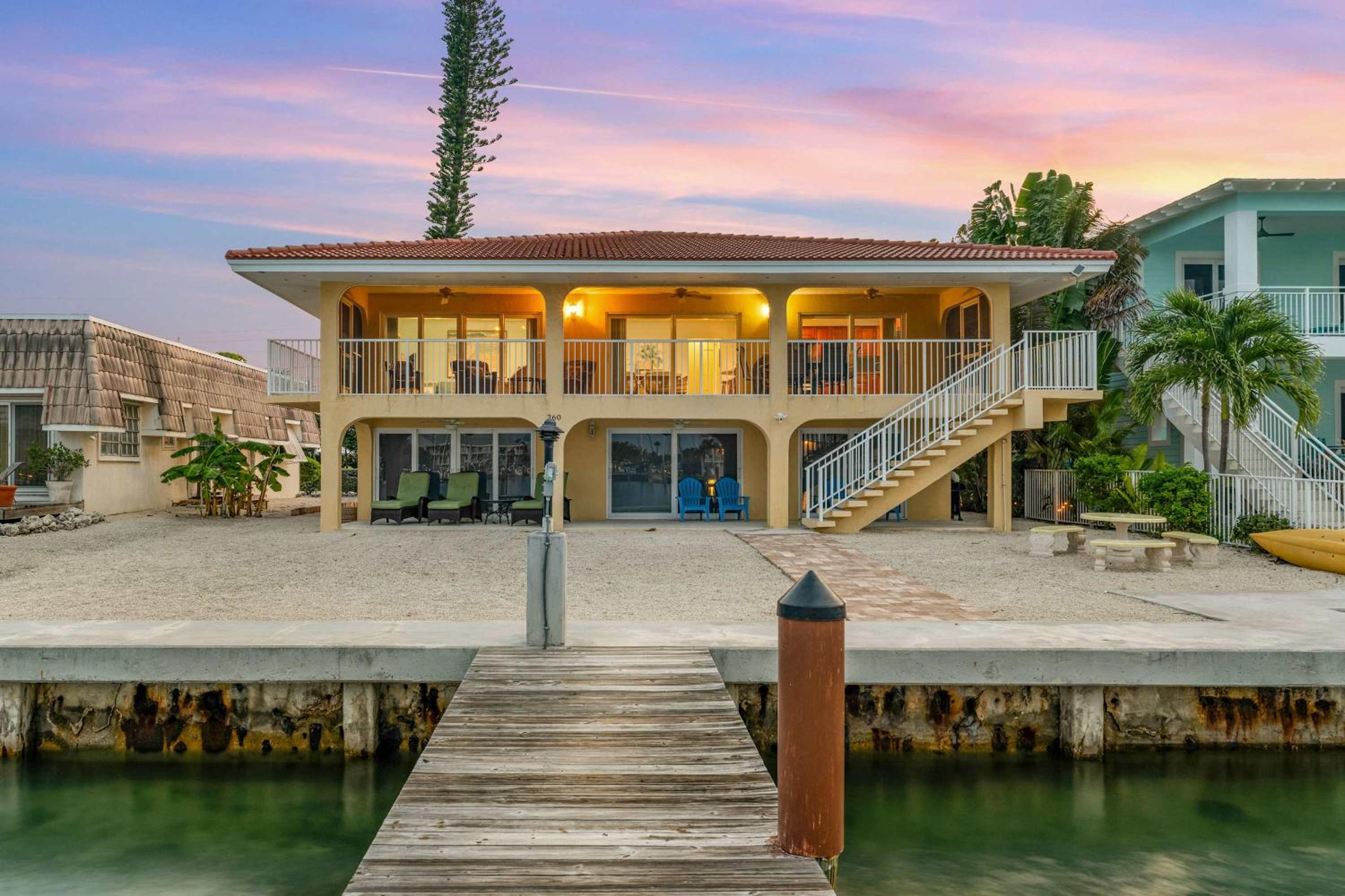 Sunset Harbor Waterfront Villa with Dock Cabana Club