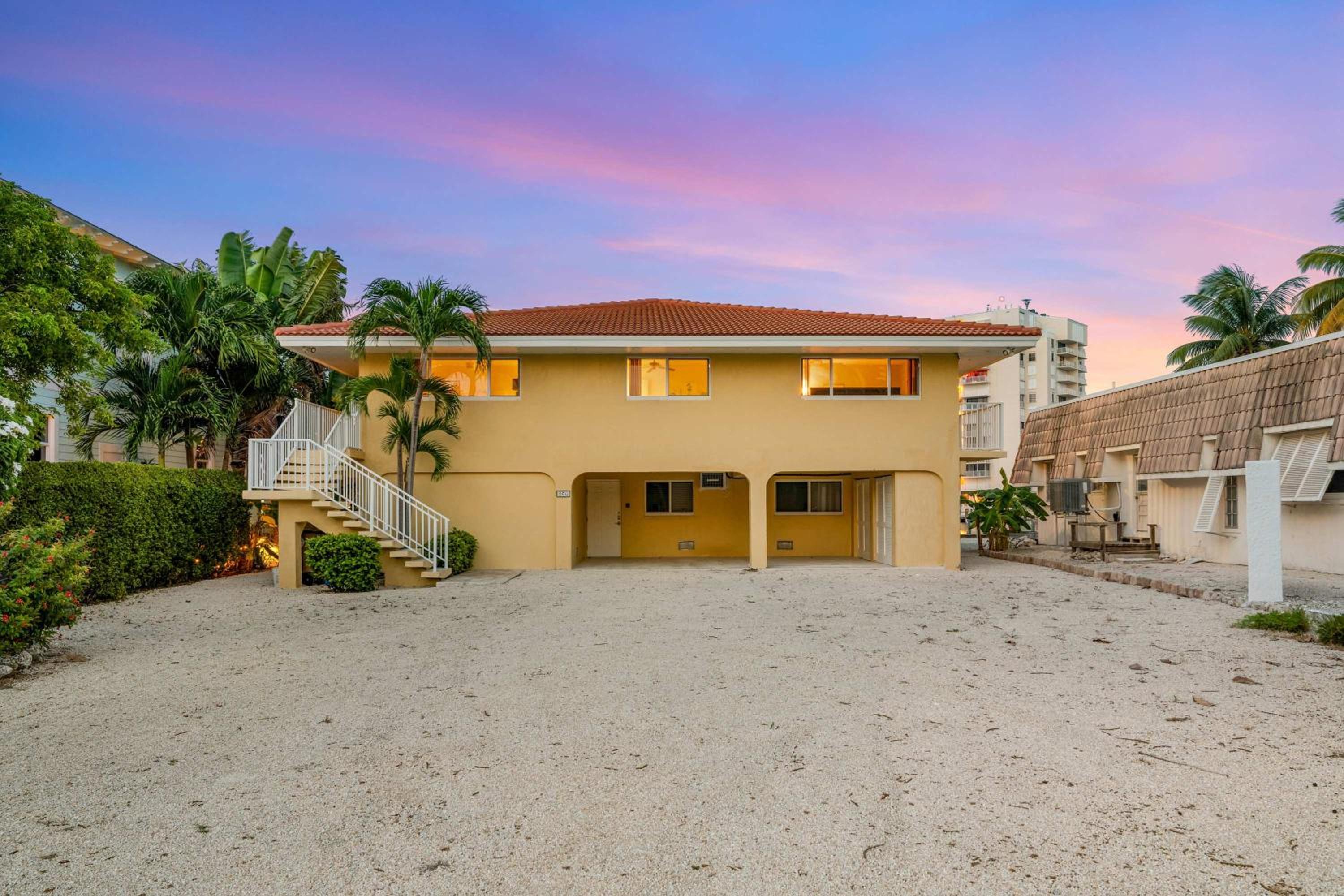 Sunset Harbor Waterfront Villa with Dock Cabana Club