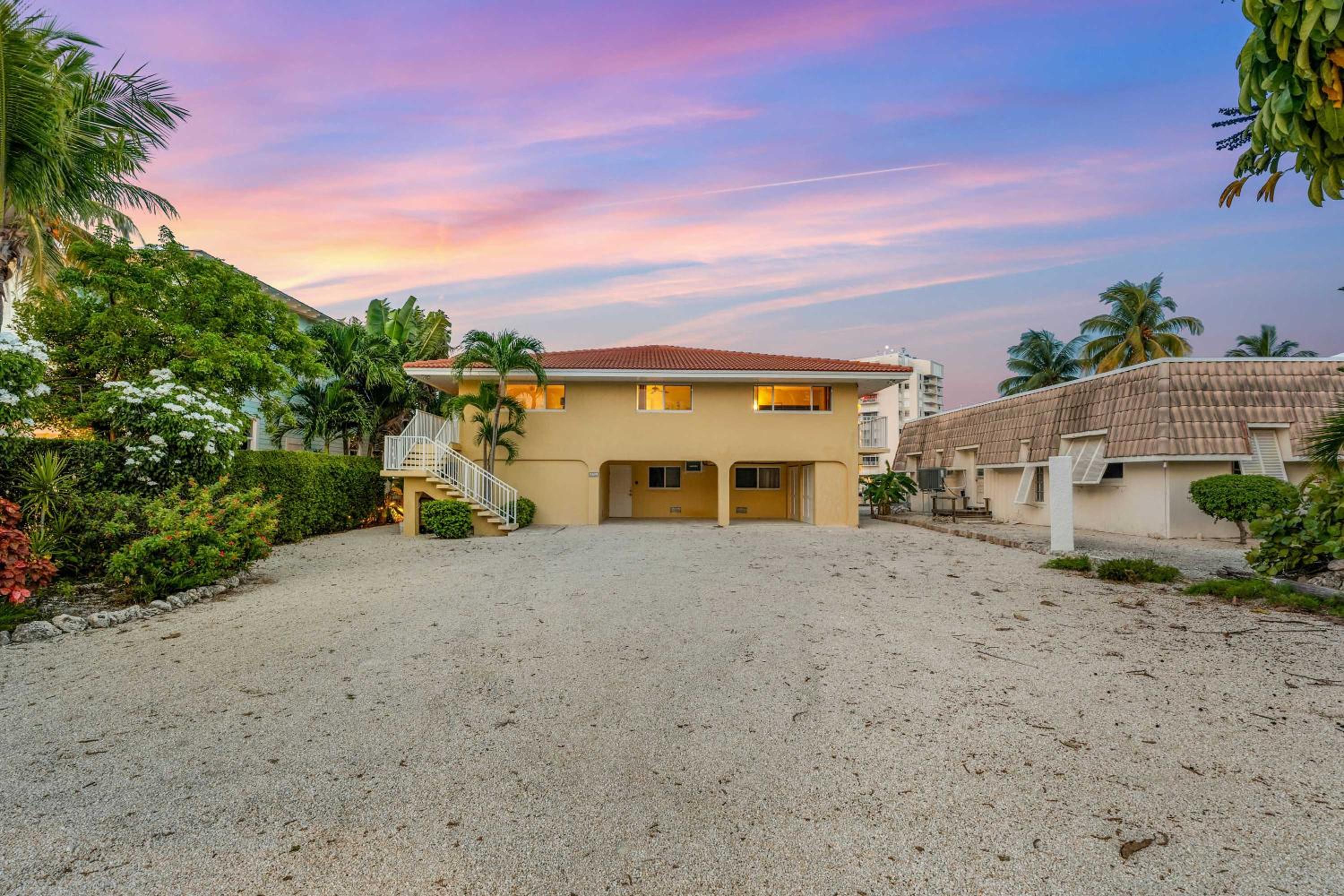Sunset Harbor Waterfront Villa with Dock Cabana Club