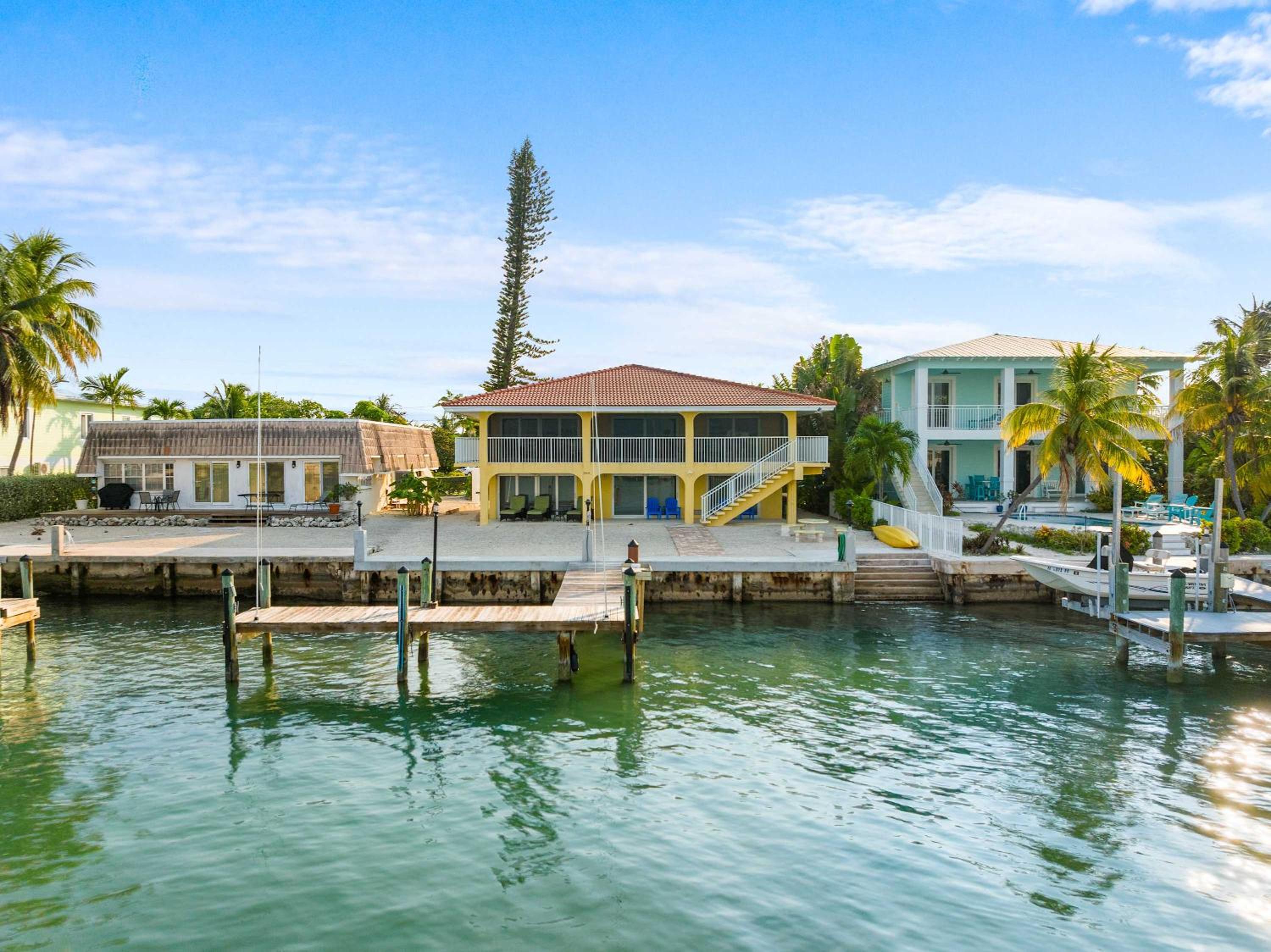 Sunset Harbor Waterfront Villa with Dock Cabana Club