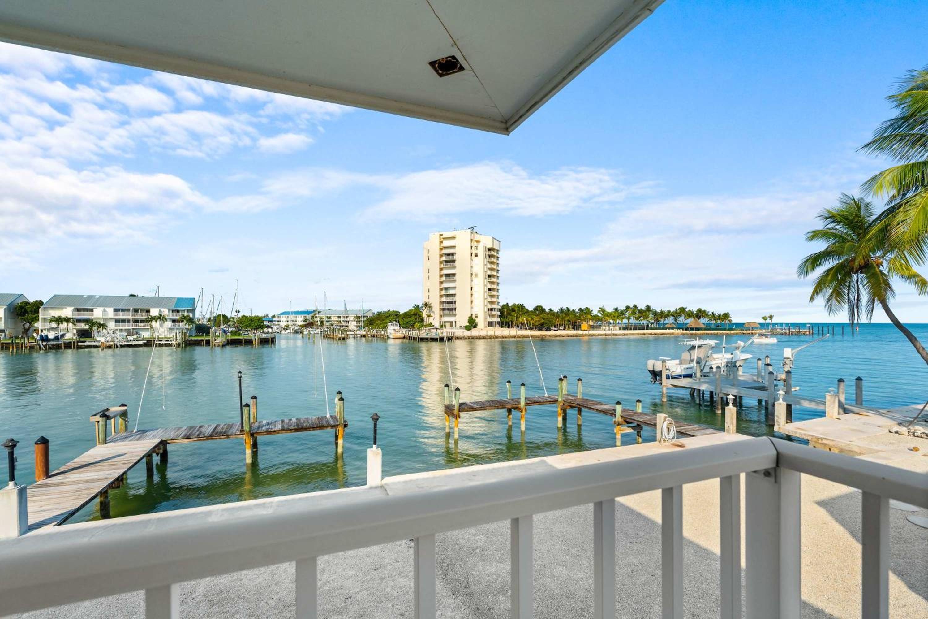 Sunset Harbor Waterfront Villa with Dock Cabana Club