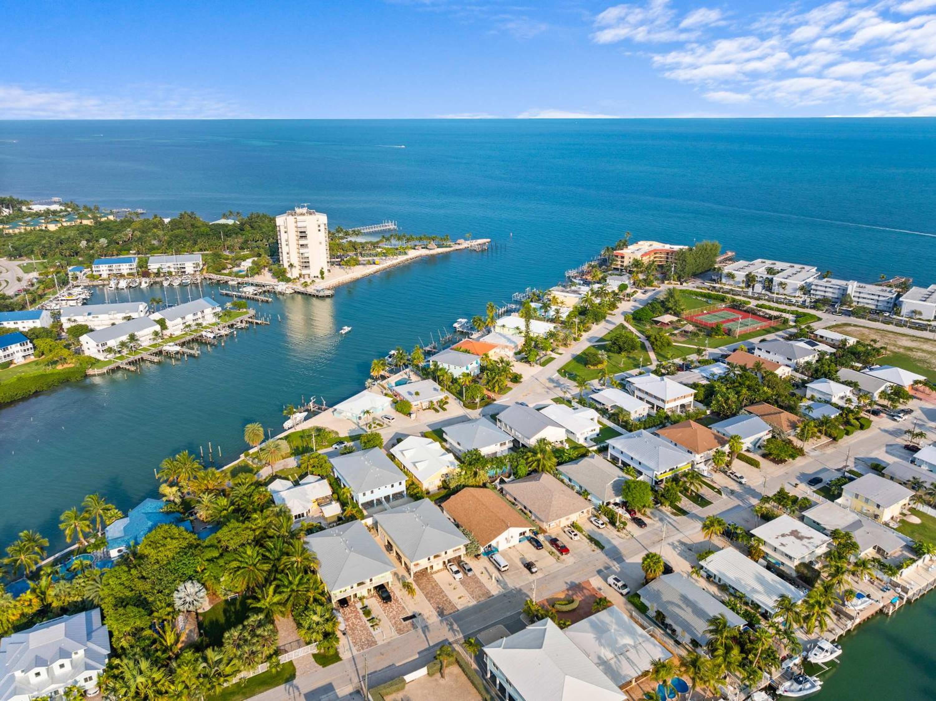 Sunset Harbor Waterfront Villa with Dock Cabana Club