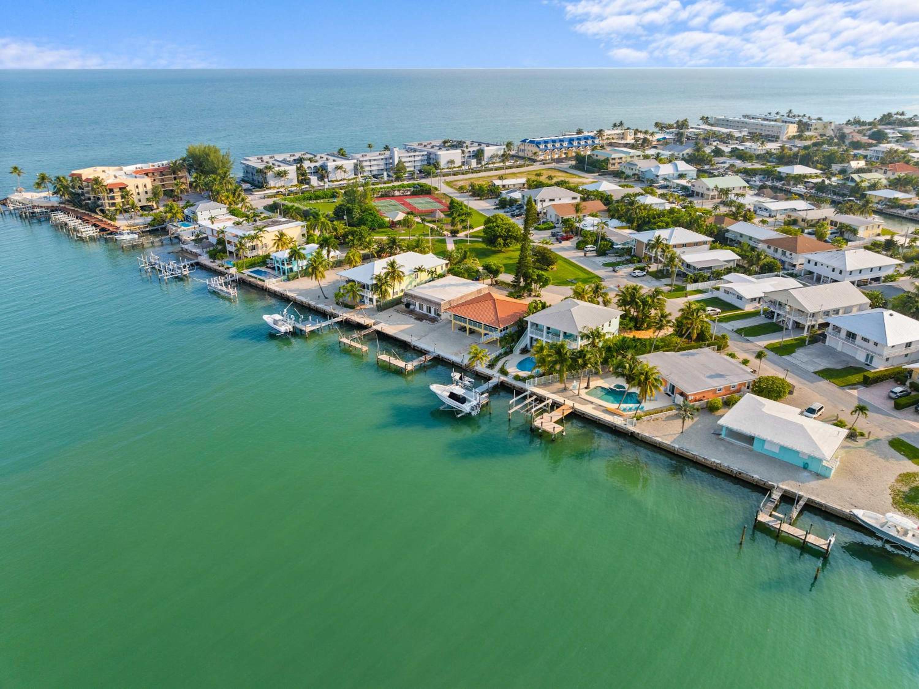 Sunset Harbor Waterfront Villa with Dock Cabana Club