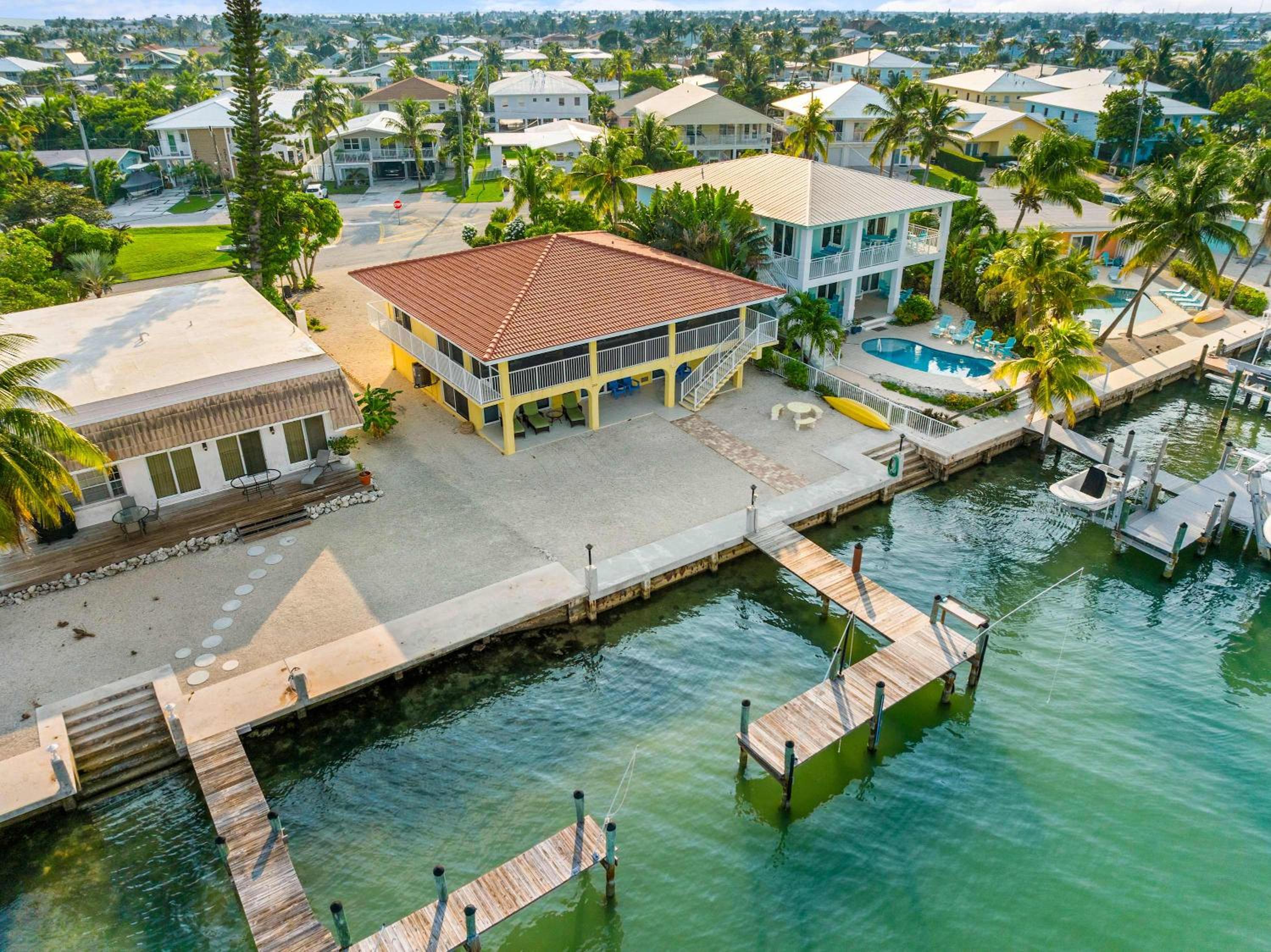 Sunset Harbor Waterfront Villa with Dock Cabana Club