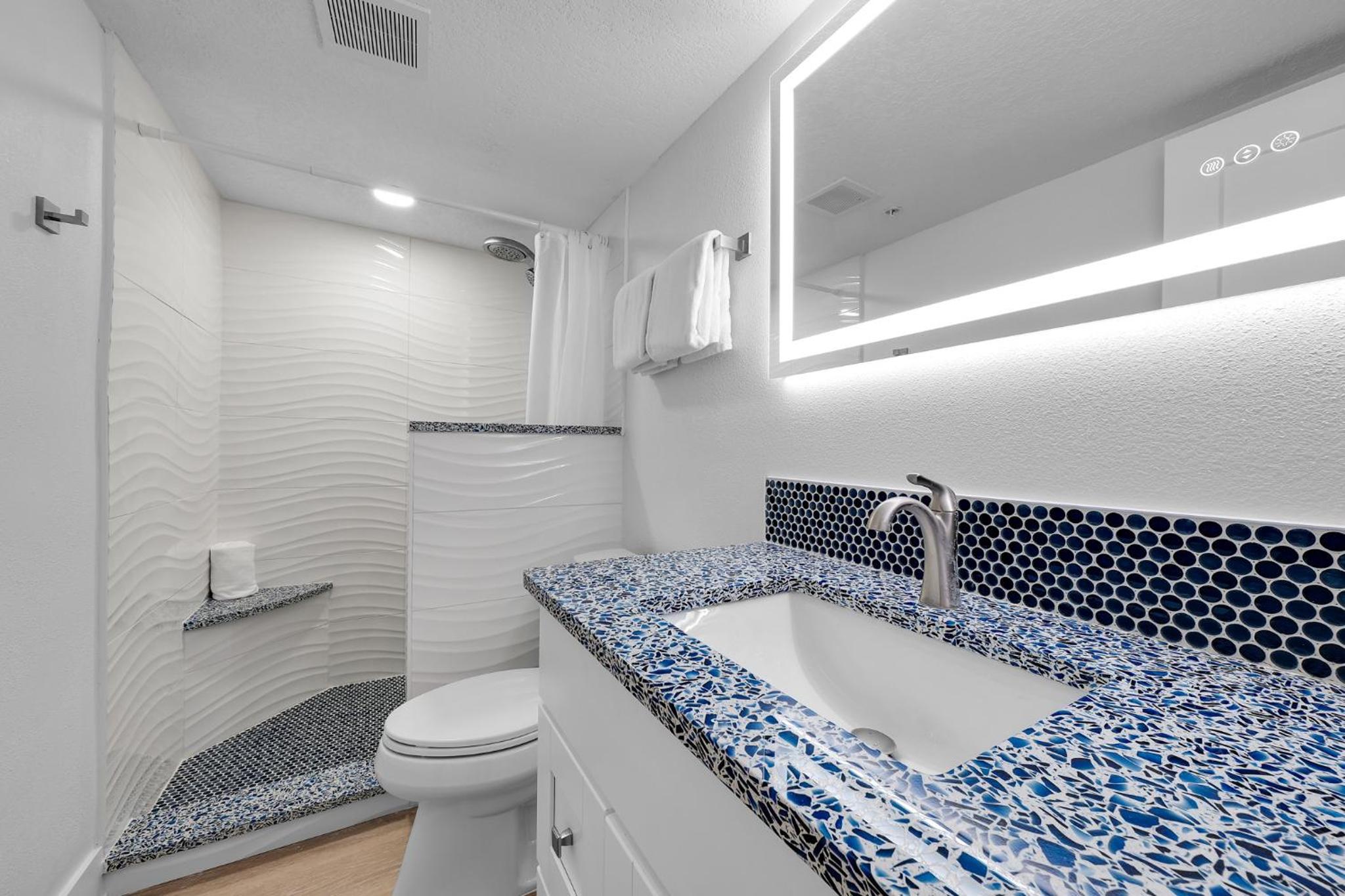 Fully renovated direct oceanfront condo with a large balcony, heated pool and beach access