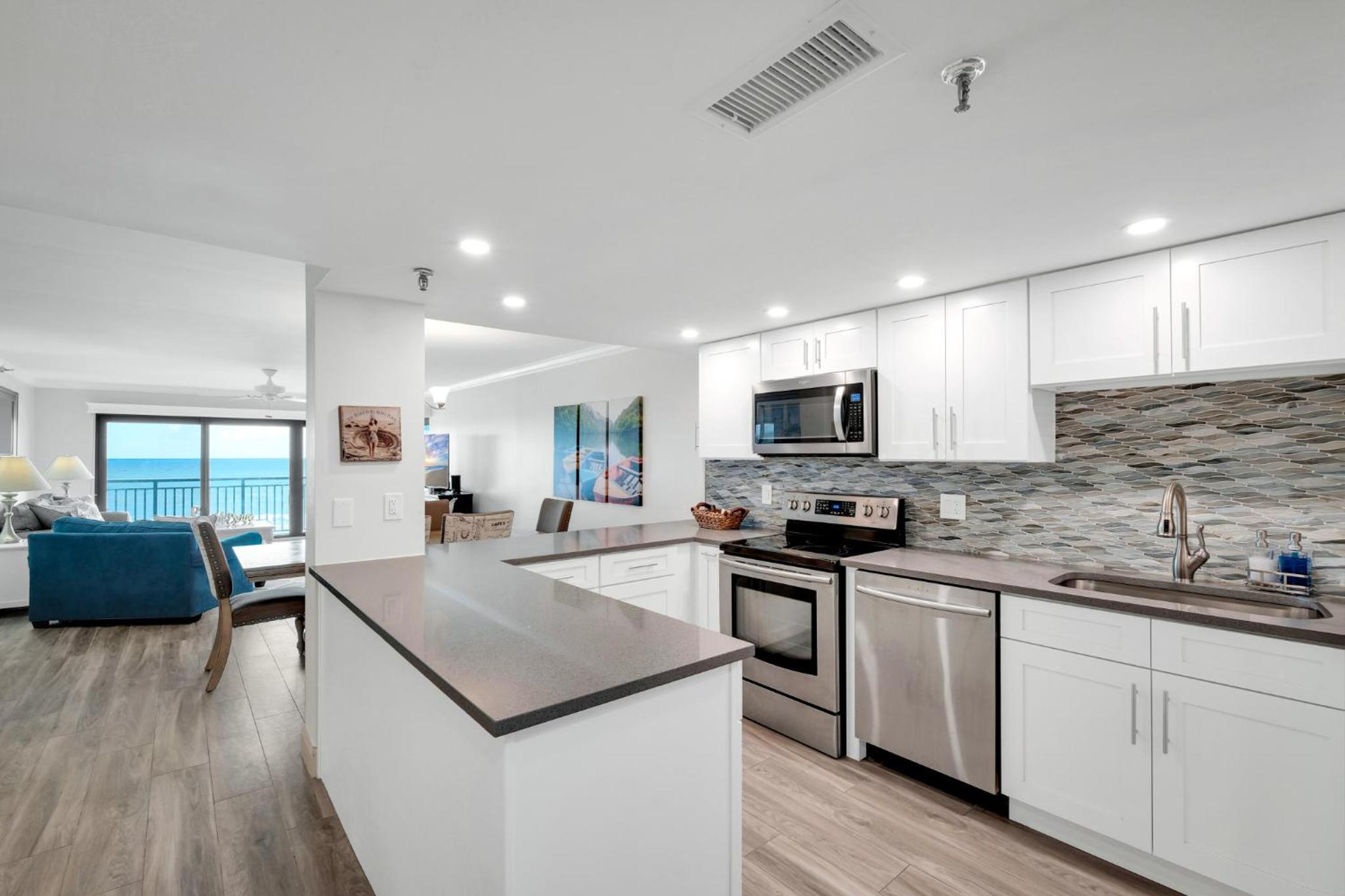 Direct oceanfront condo with a large balcony and a heated beachfront pool