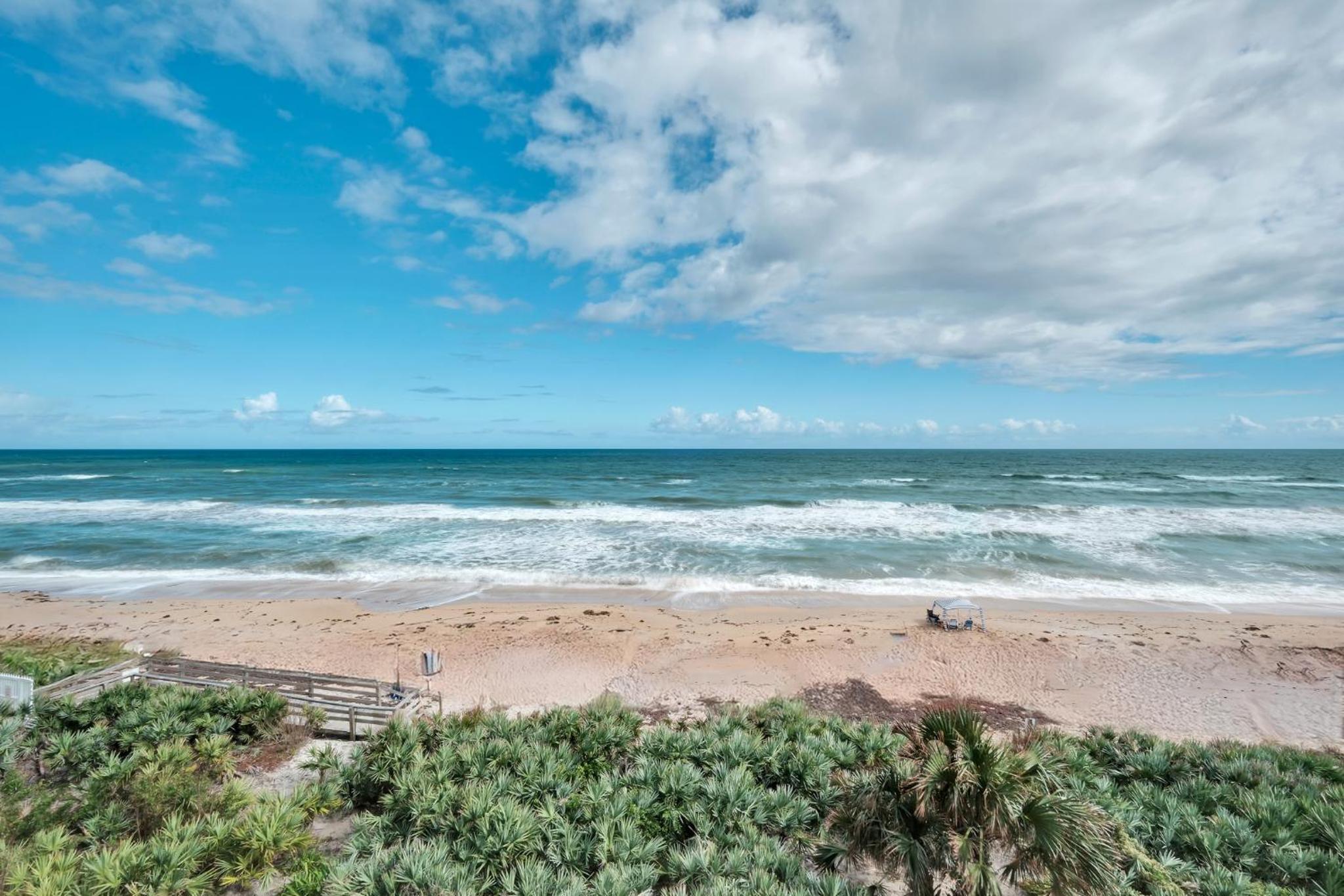 Direct oceanfront condo with a large balcony and a heated beachfront pool