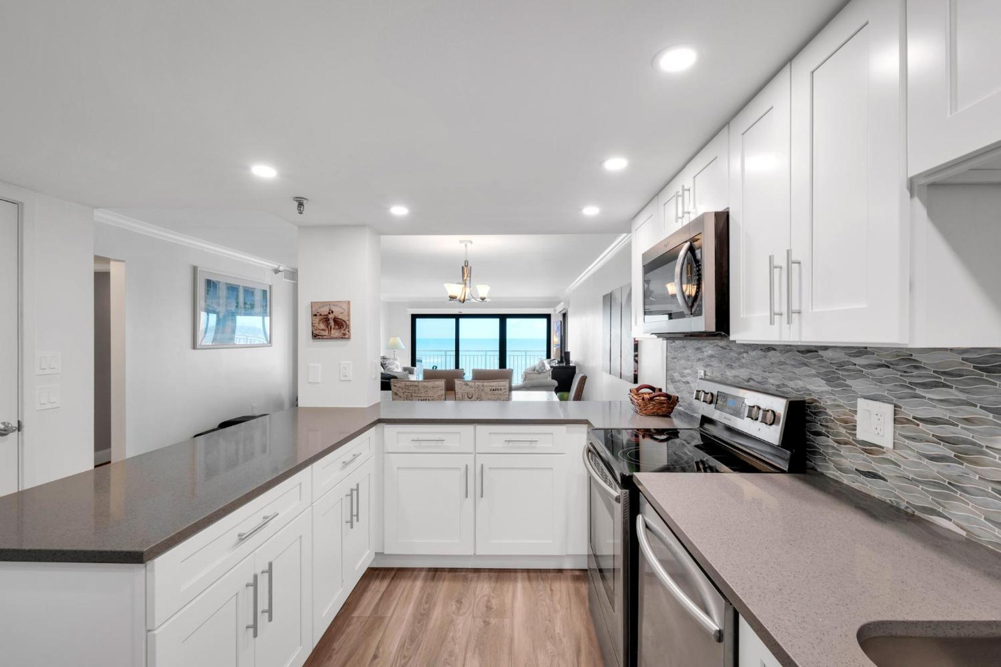 Direct oceanfront condo with a large balcony and a heated beachfront pool