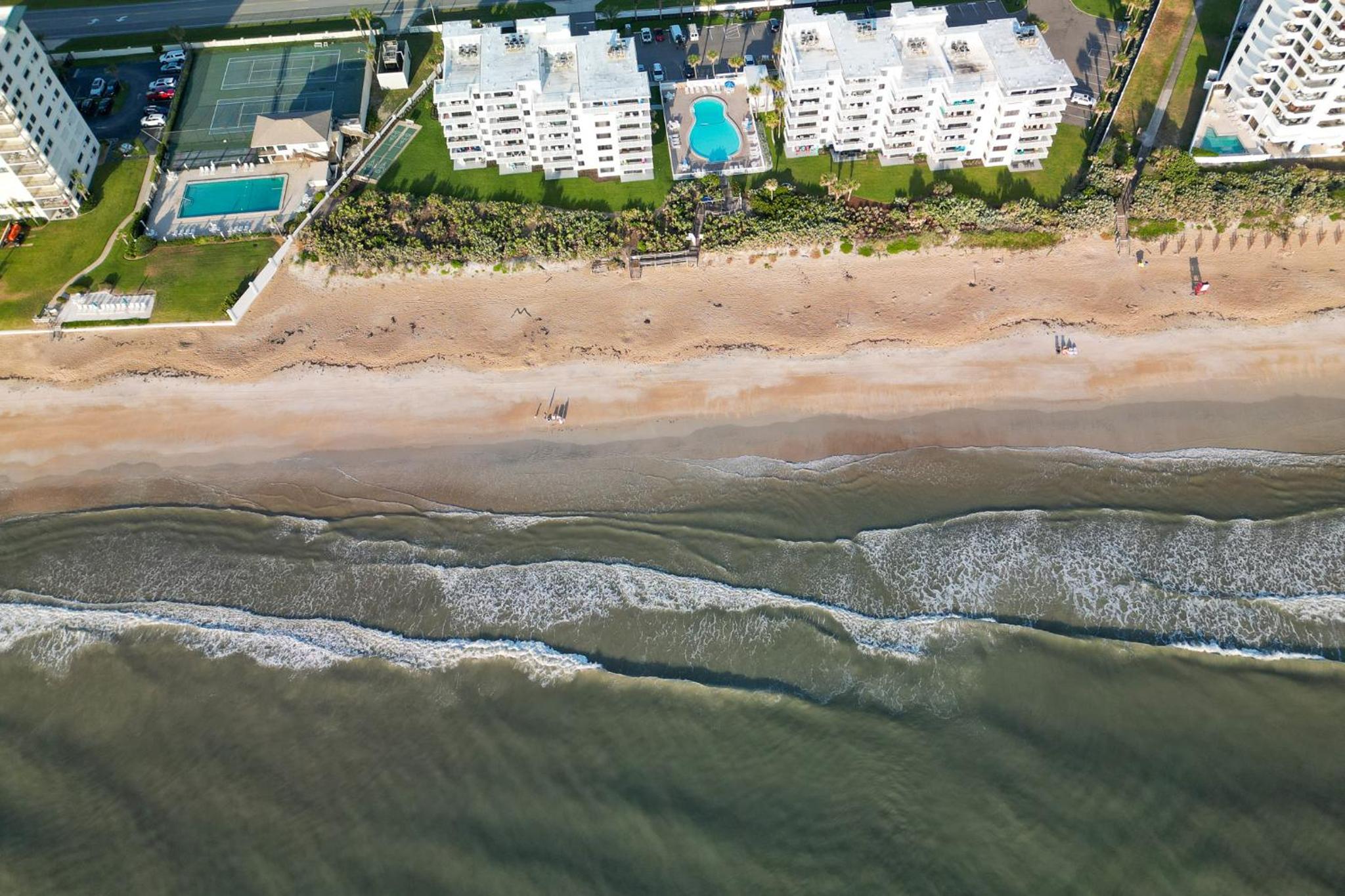 Fully renovated direct oceanfront condo with a large balcony, heated pool and beach access