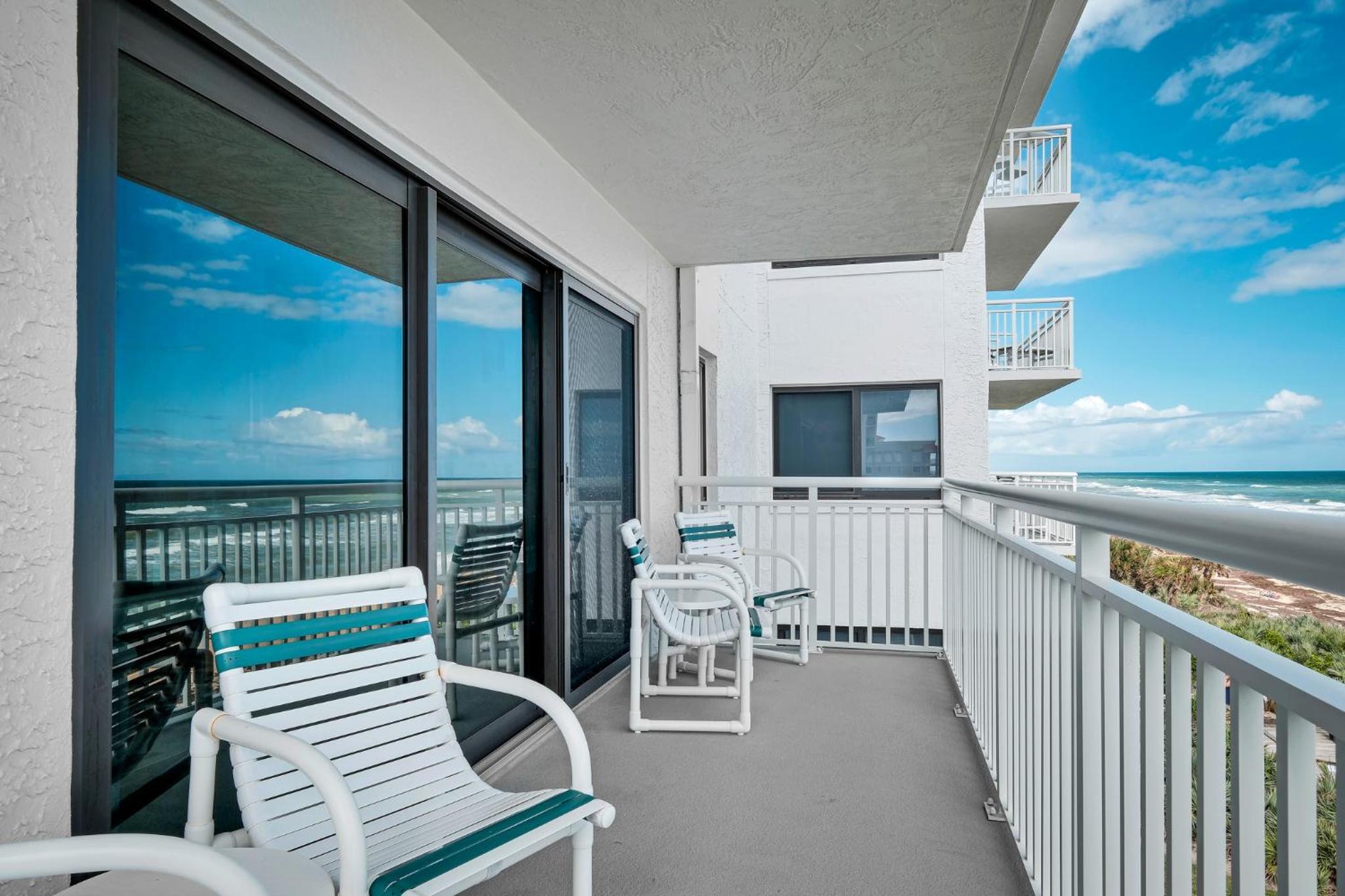 Direct oceanfront condo with a large balcony and a heated beachfront pool