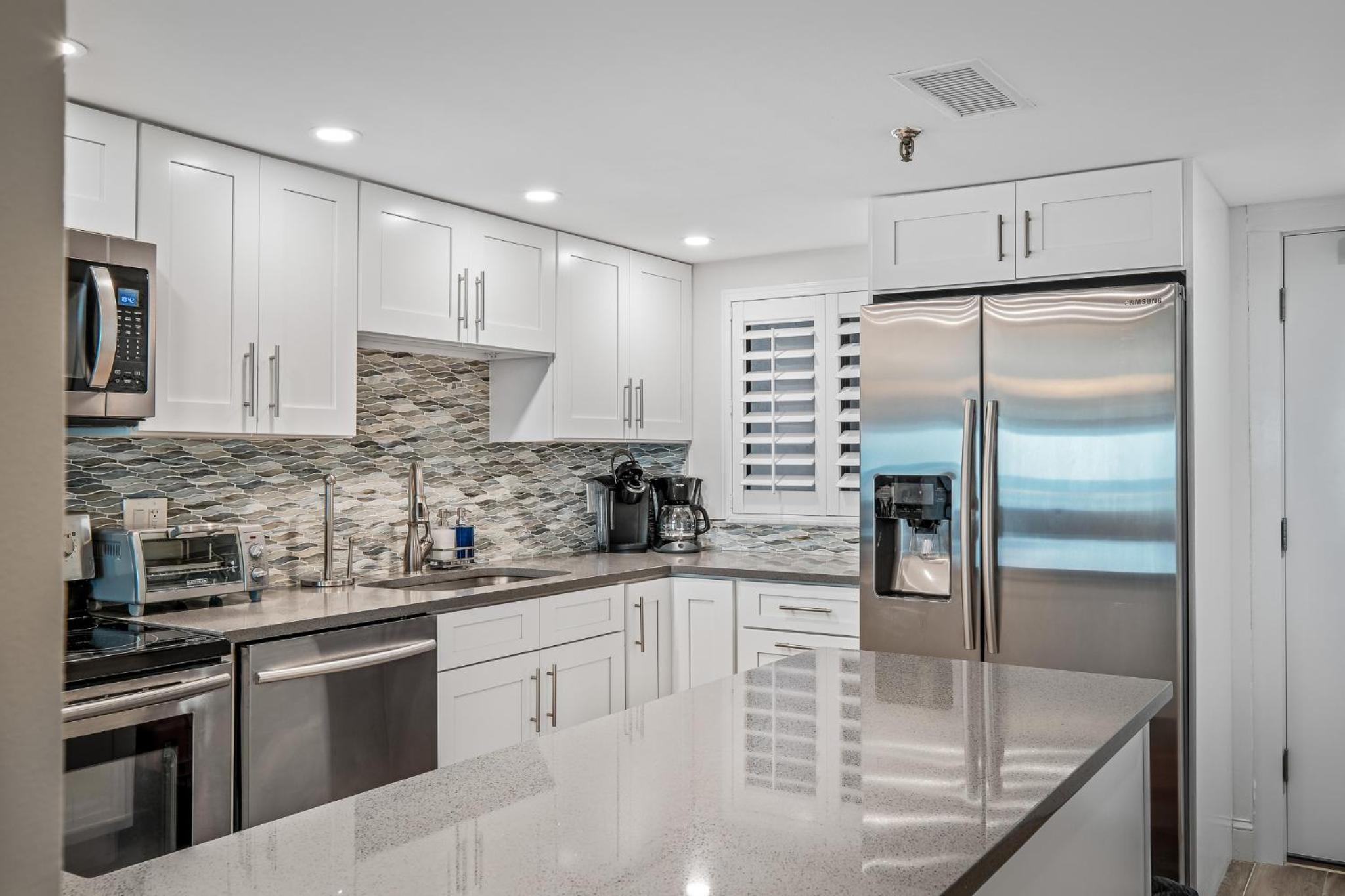 Direct oceanfront condo with a large balcony and a heated beachfront pool