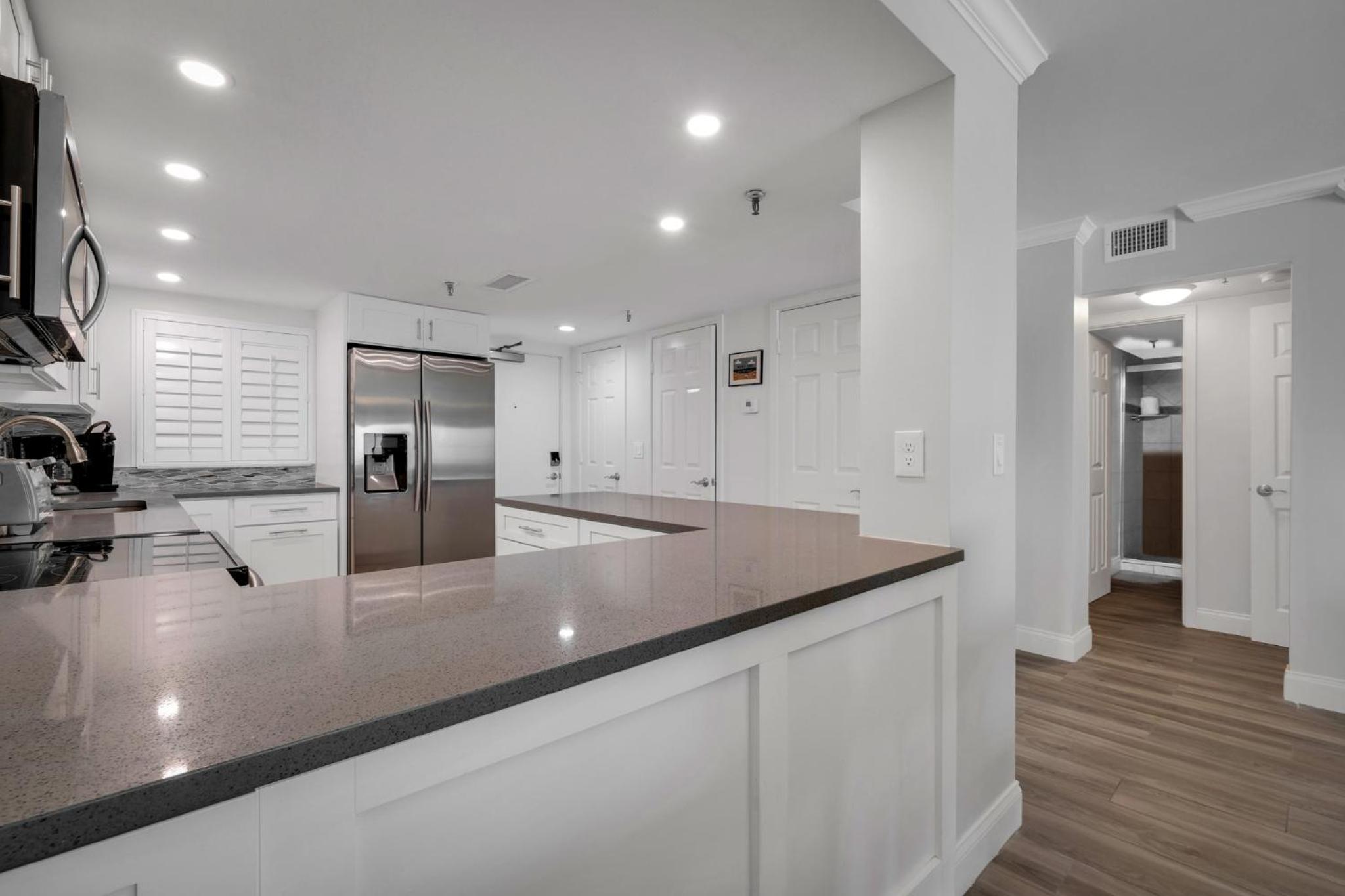 Direct oceanfront condo with a large balcony and a heated beachfront pool