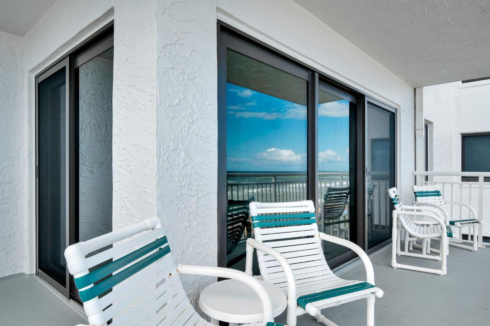 Direct oceanfront condo with a large balcony and a heated beachfront pool