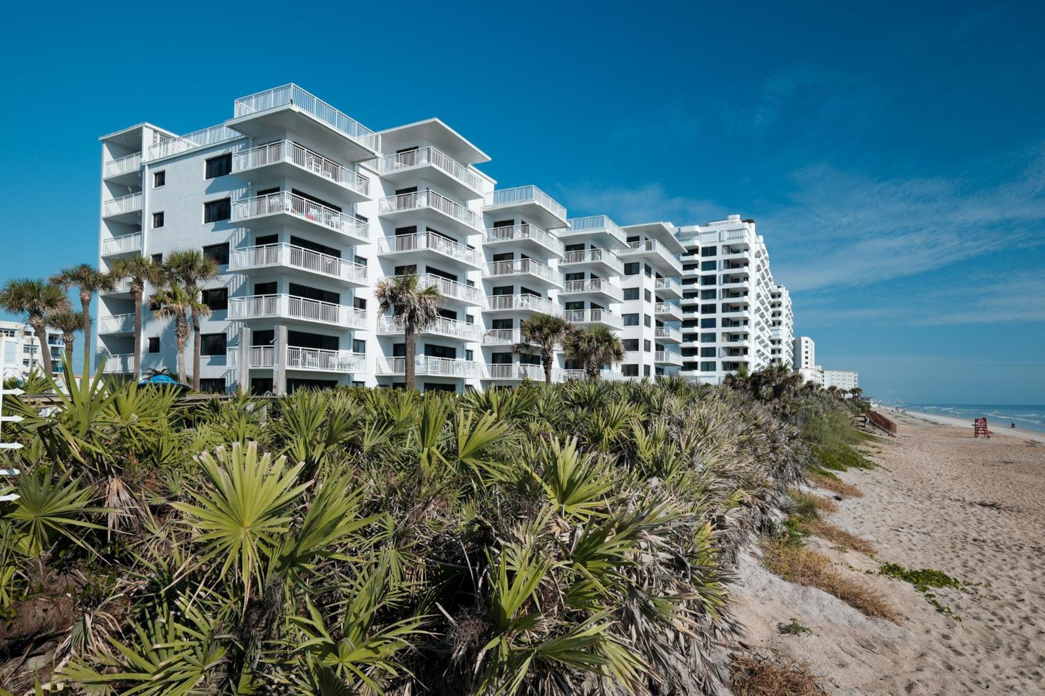 Direct oceanfront condo with a large balcony and a heated beachfront pool