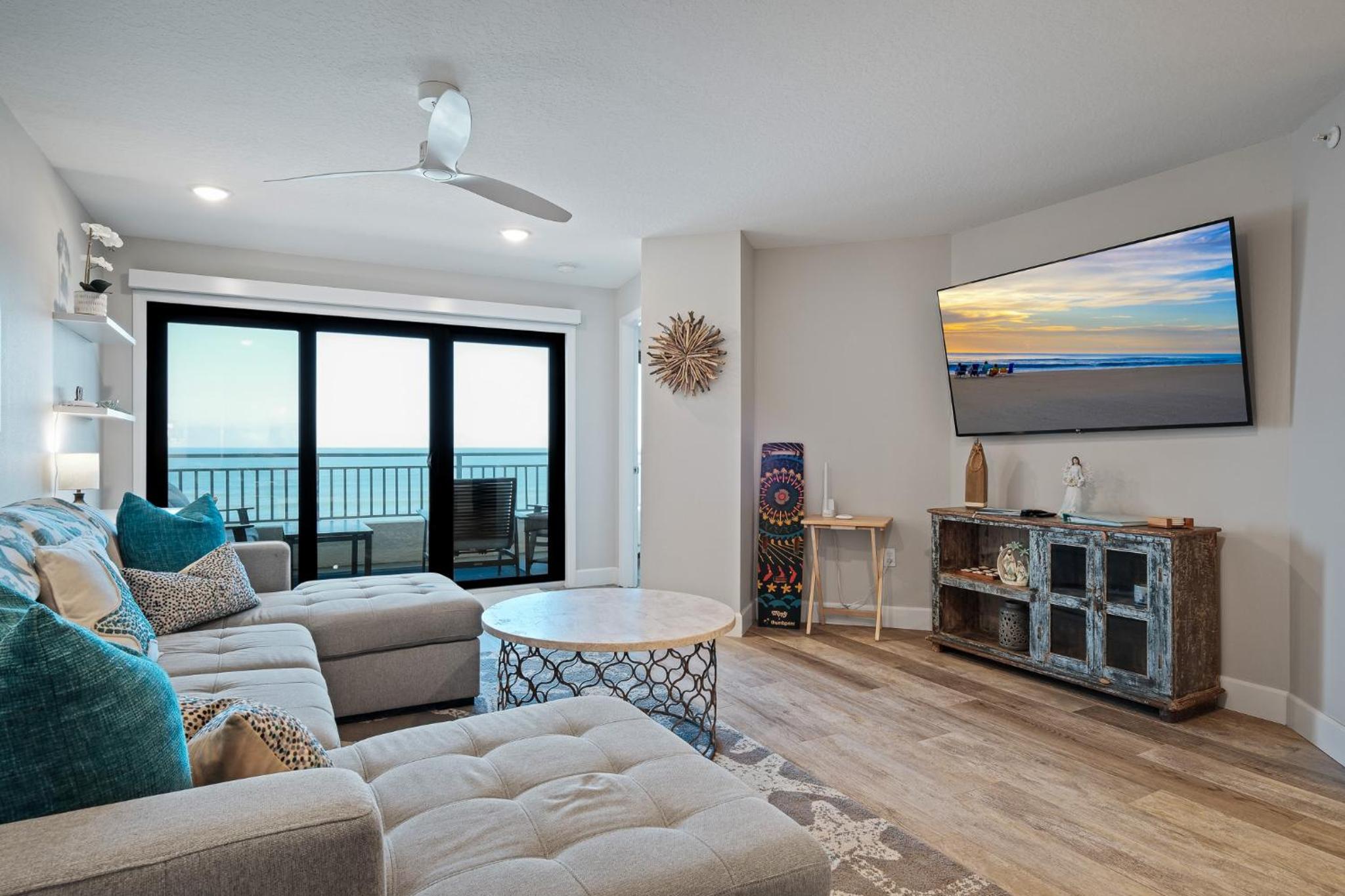 Stunning direct oceanfront condo with a balcony, hot tub, and heated pool
