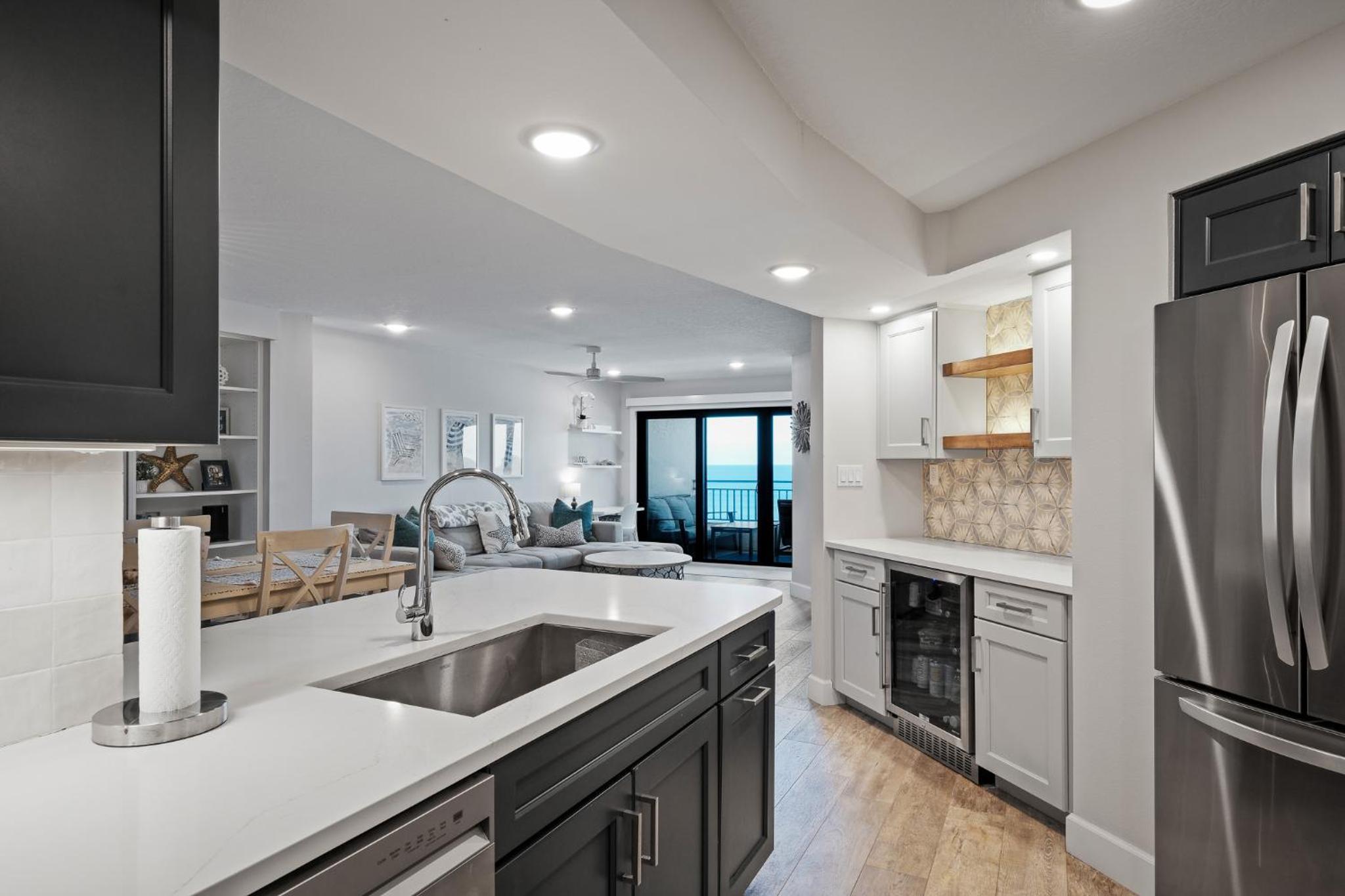 Stunning direct oceanfront condo with a balcony, hot tub, and heated pool