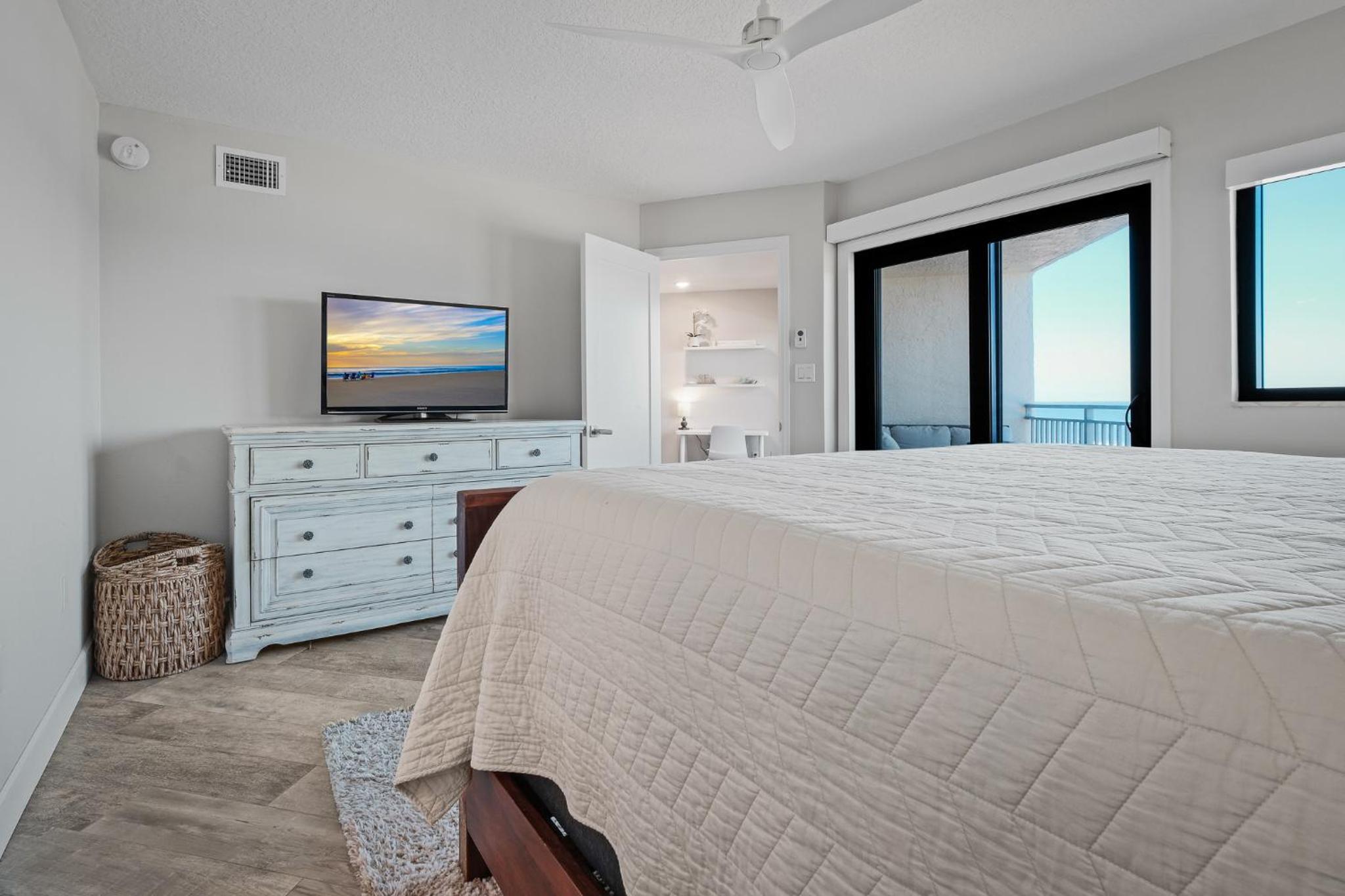 Stunning direct oceanfront condo with a balcony, hot tub, and heated pool