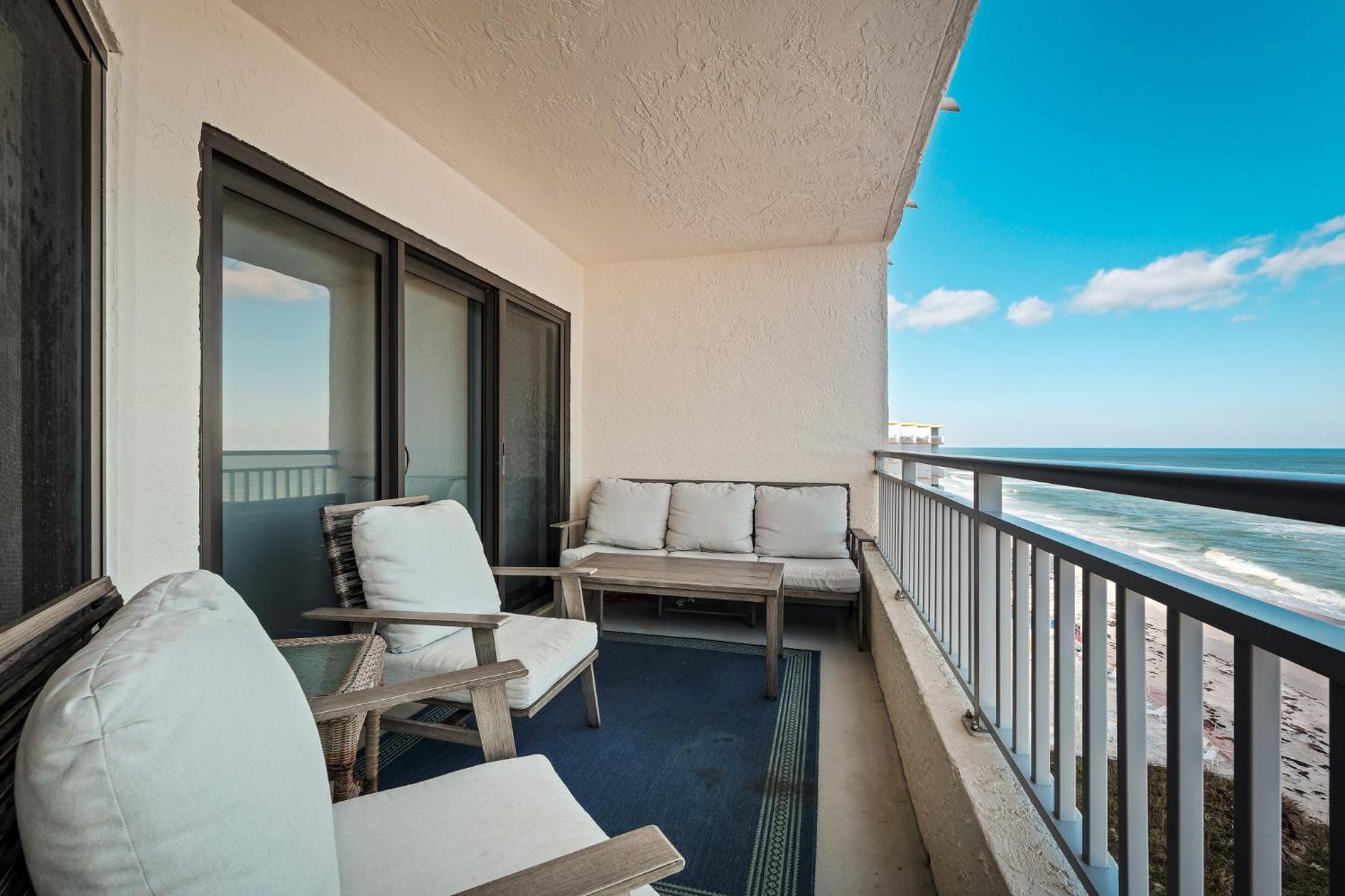 Stunning direct oceanfront condo with a balcony, hot tub, and heated pool