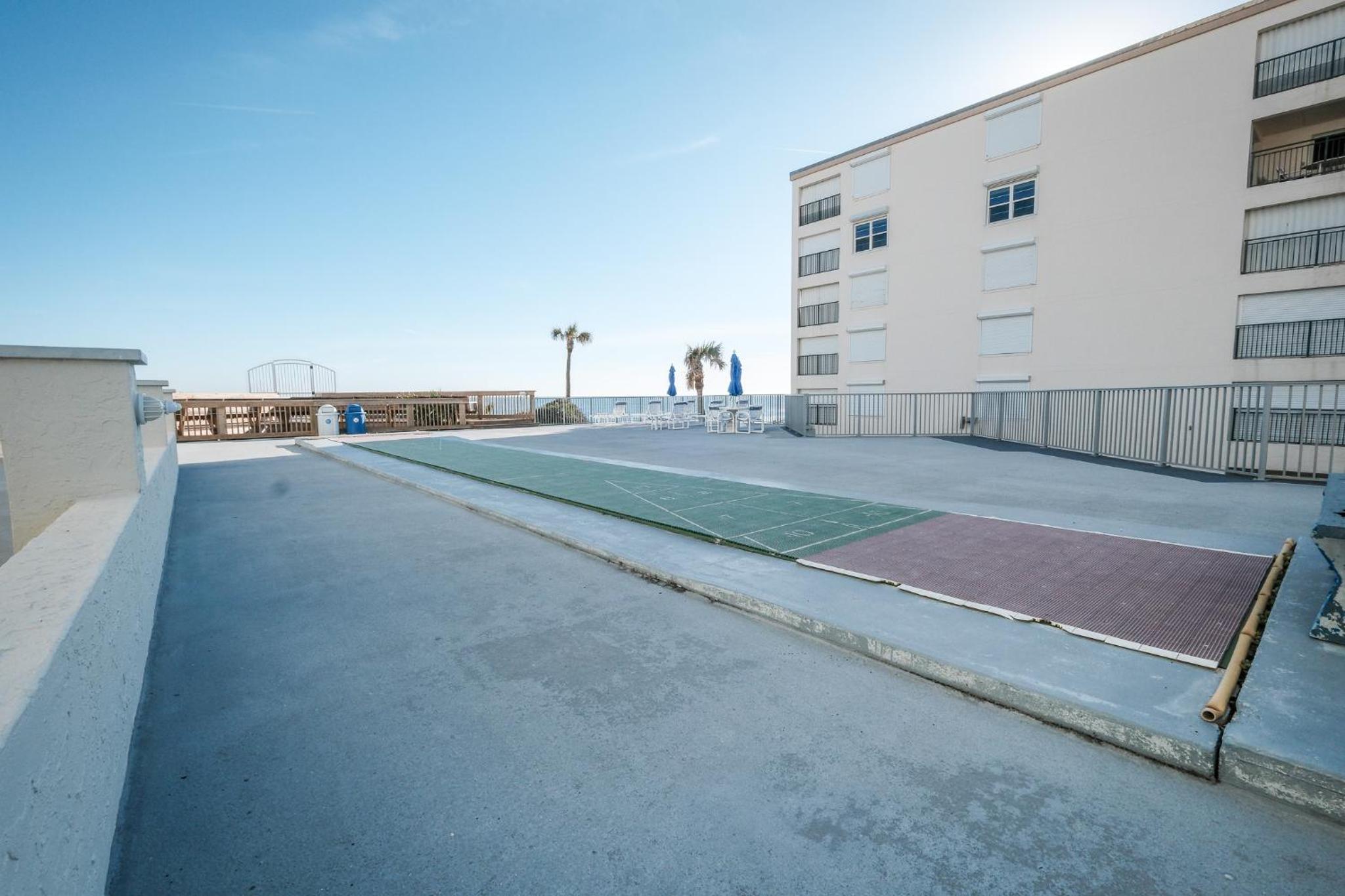 Stunning direct oceanfront condo with a balcony, hot tub, and heated pool