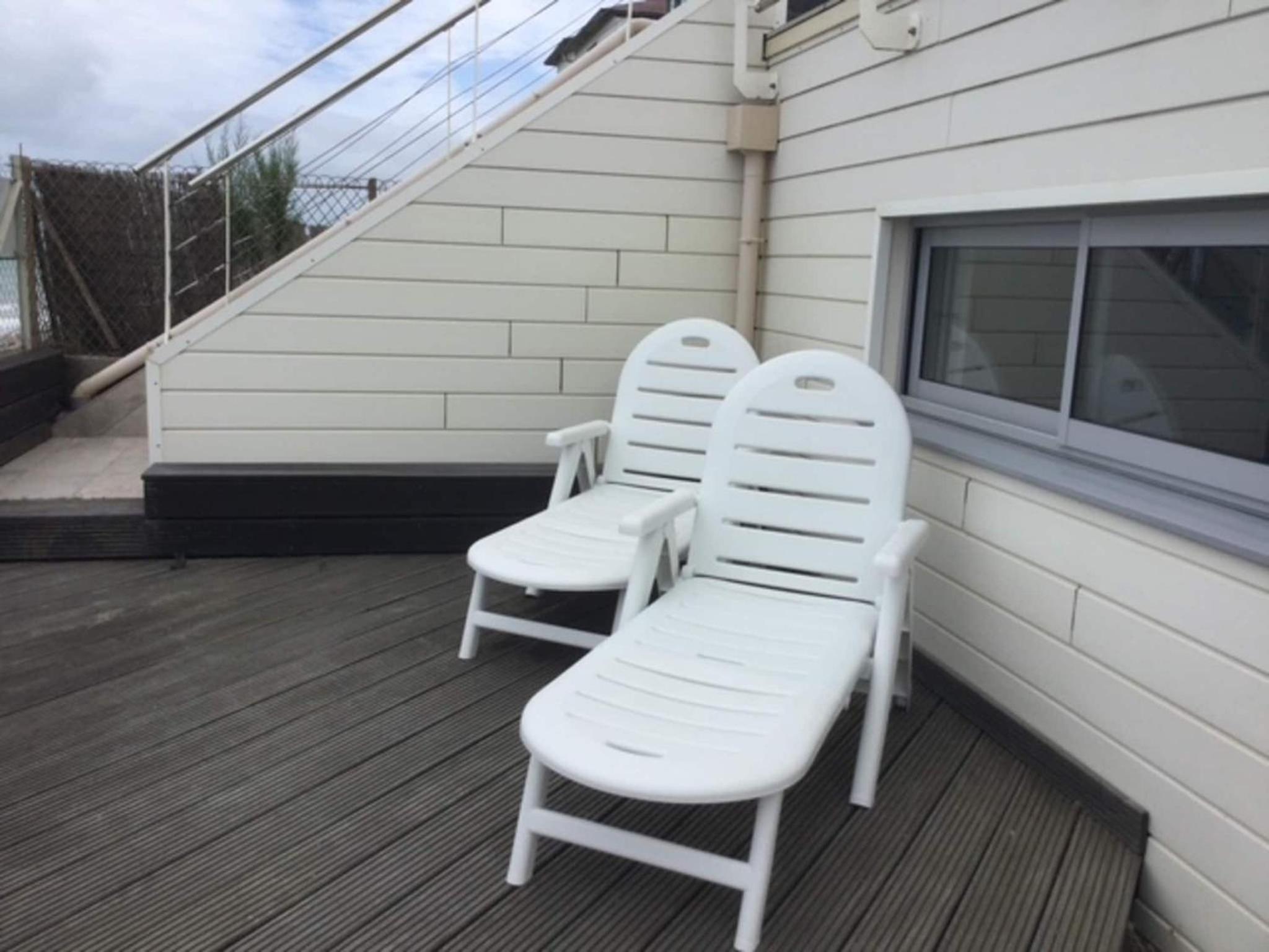 1-bedroom apartment with view of private beach