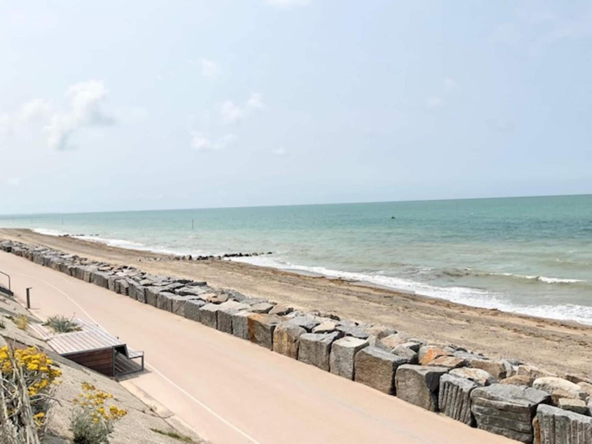 1-bedroom apartment with view of private beach