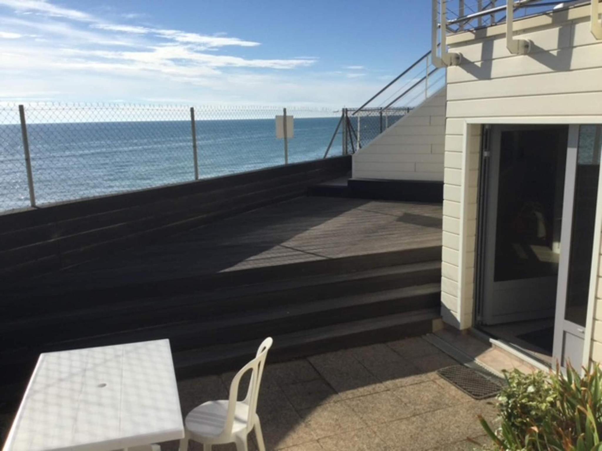 1-bedroom apartment with view of private beach