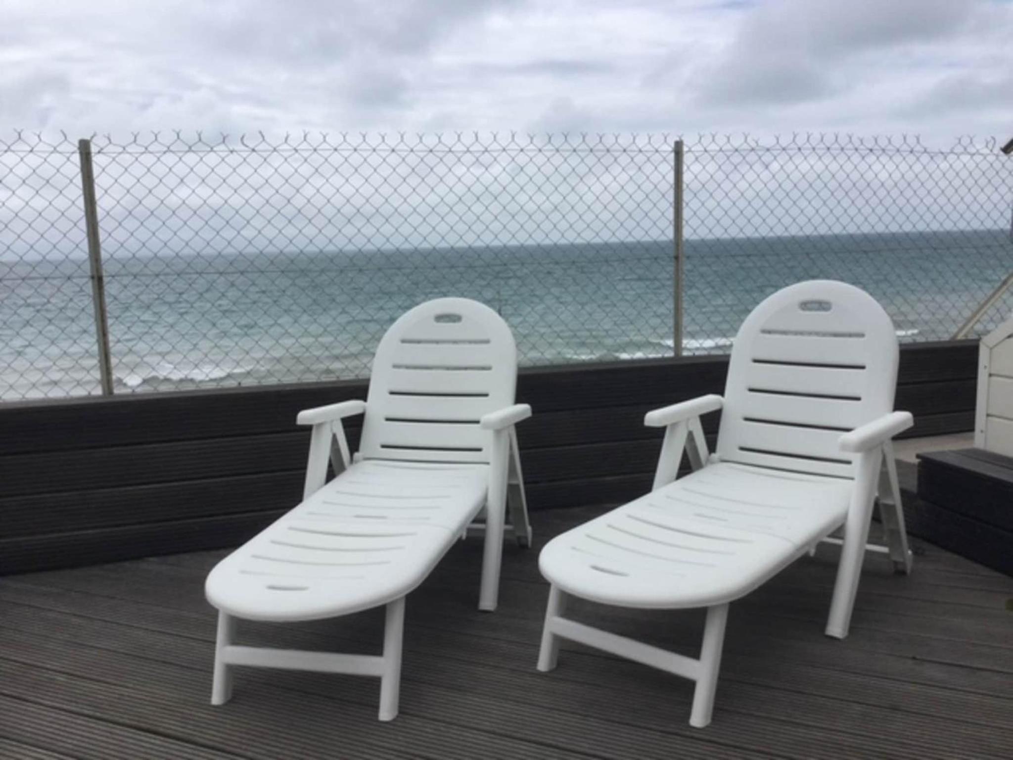 1-bedroom apartment with view of private beach