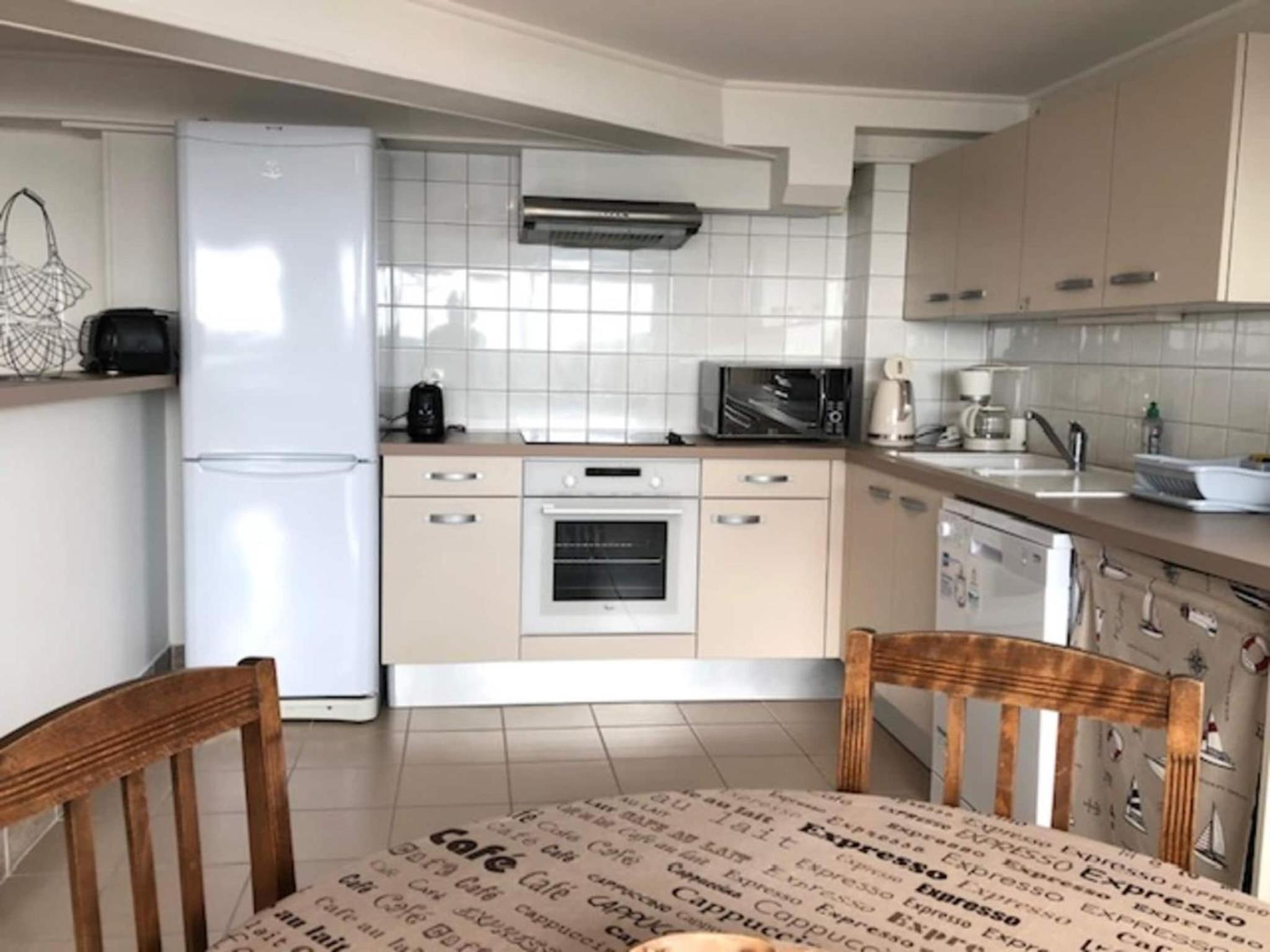1-bedroom apartment with view of private beach