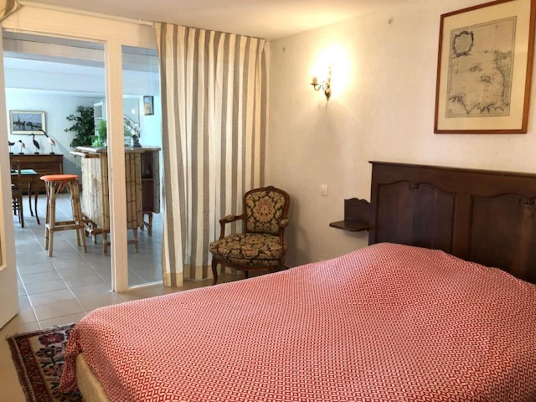 1-bedroom apartment with view of private beach