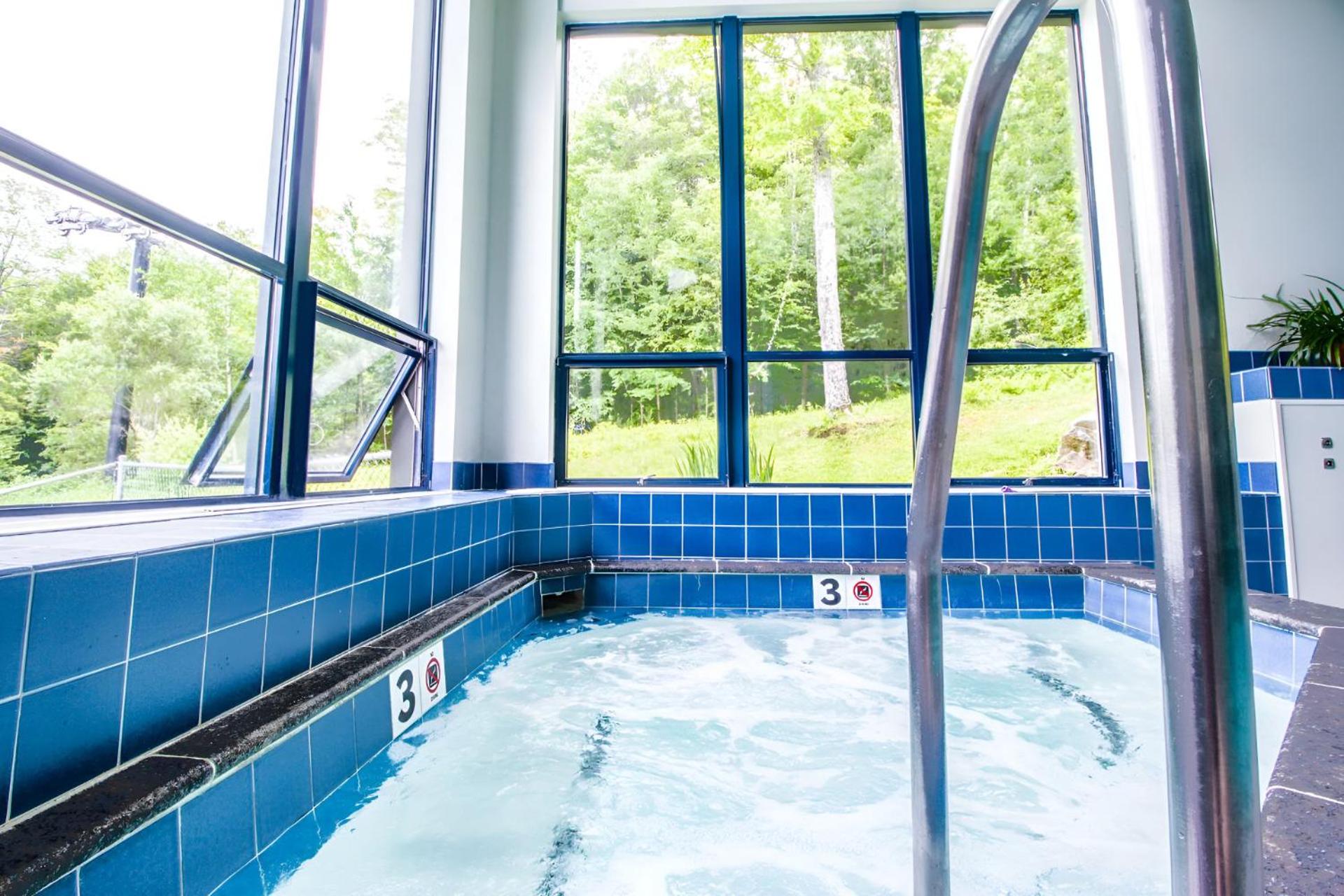 Ski-In, Ski-Out Sunrise Village Killington Condo - 2BR, Fireplace, Pool, Pet Friendly