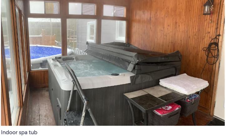 Large deck hot tub massage chair and seasonal swimming pool