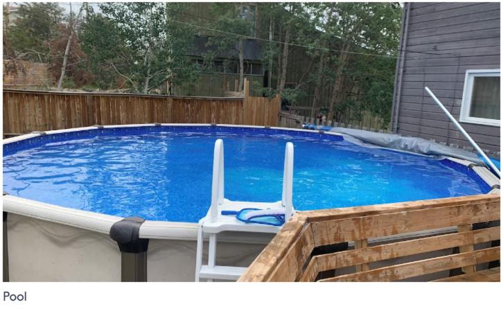 Large deck hot tub massage chair and seasonal swimming pool