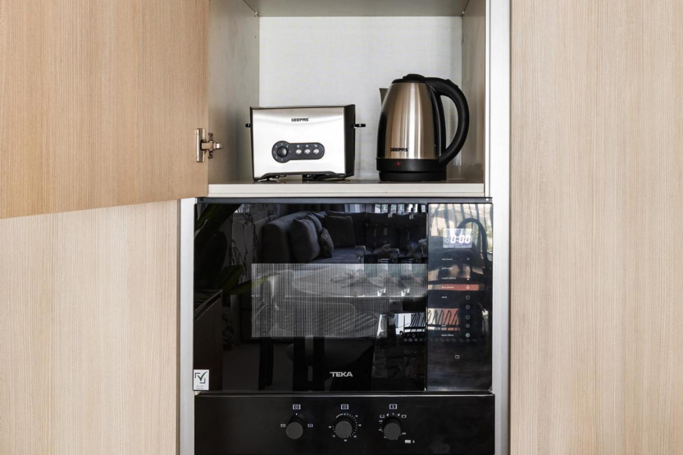 Stylish 1BR with PS5, Sauna and Kids' Play Area