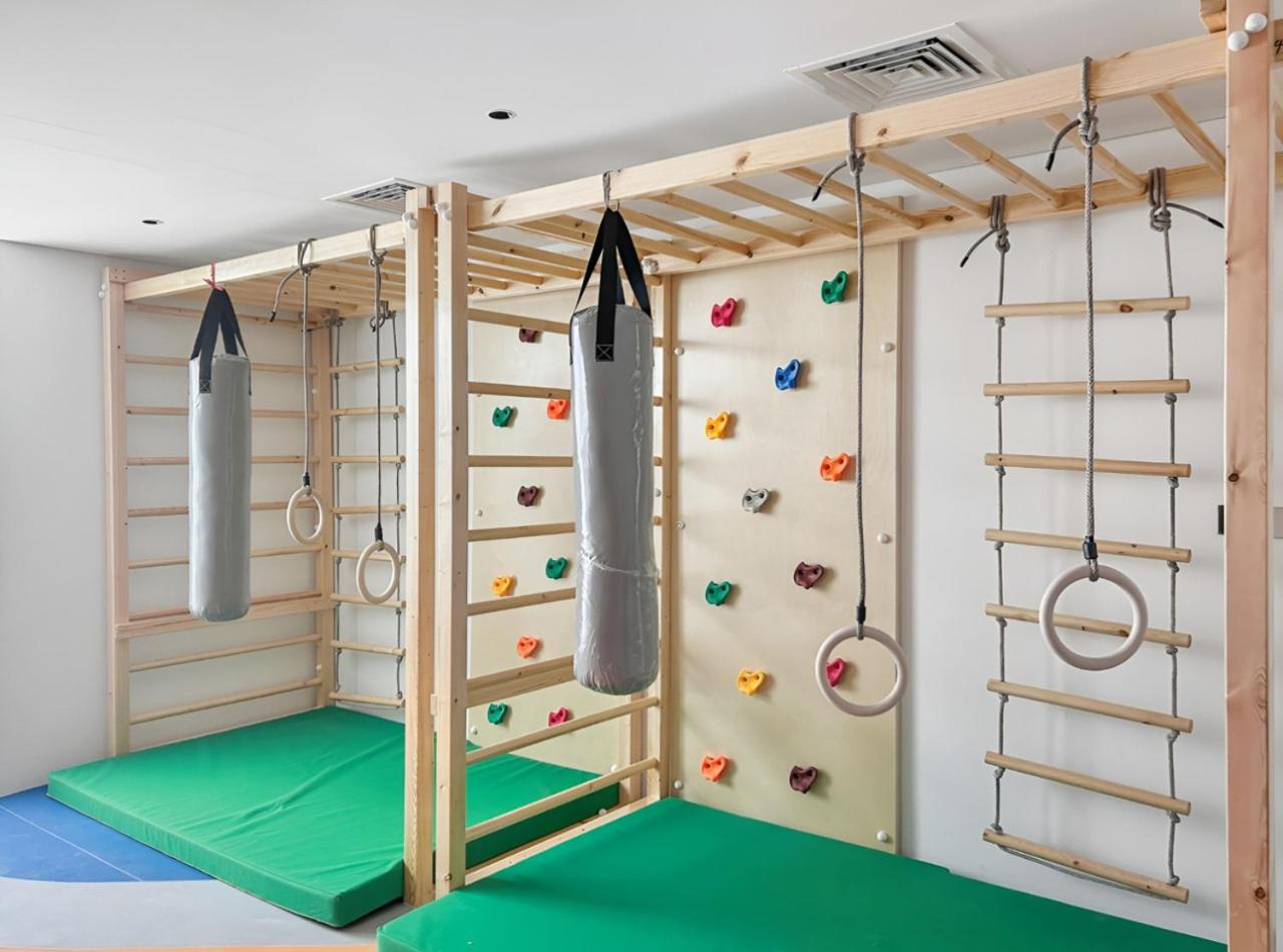 Stylish 1BR with PS5, Sauna and Kids' Play Area