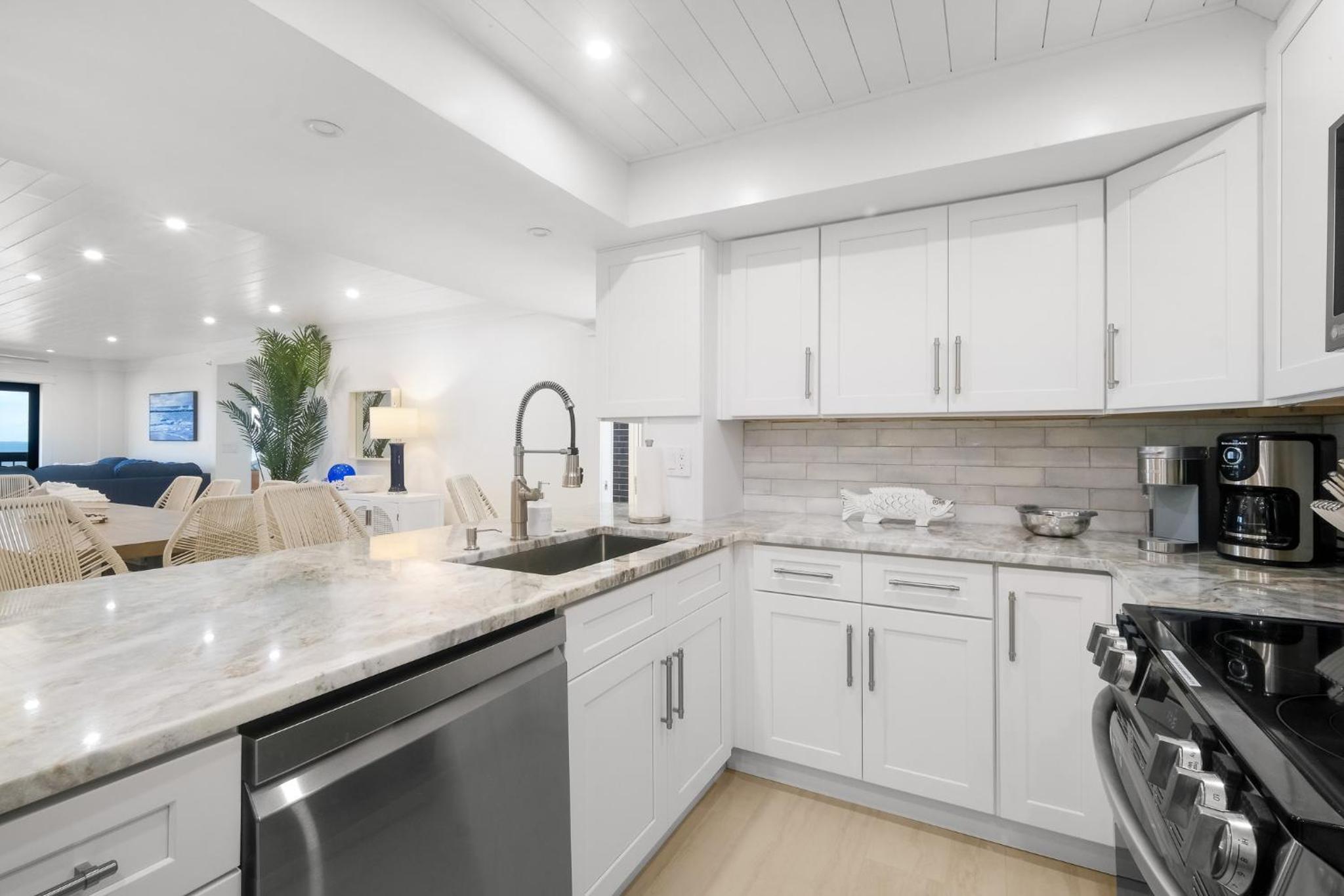 Luxury direct oceanfront corner with large private balcony, heated pool and garage