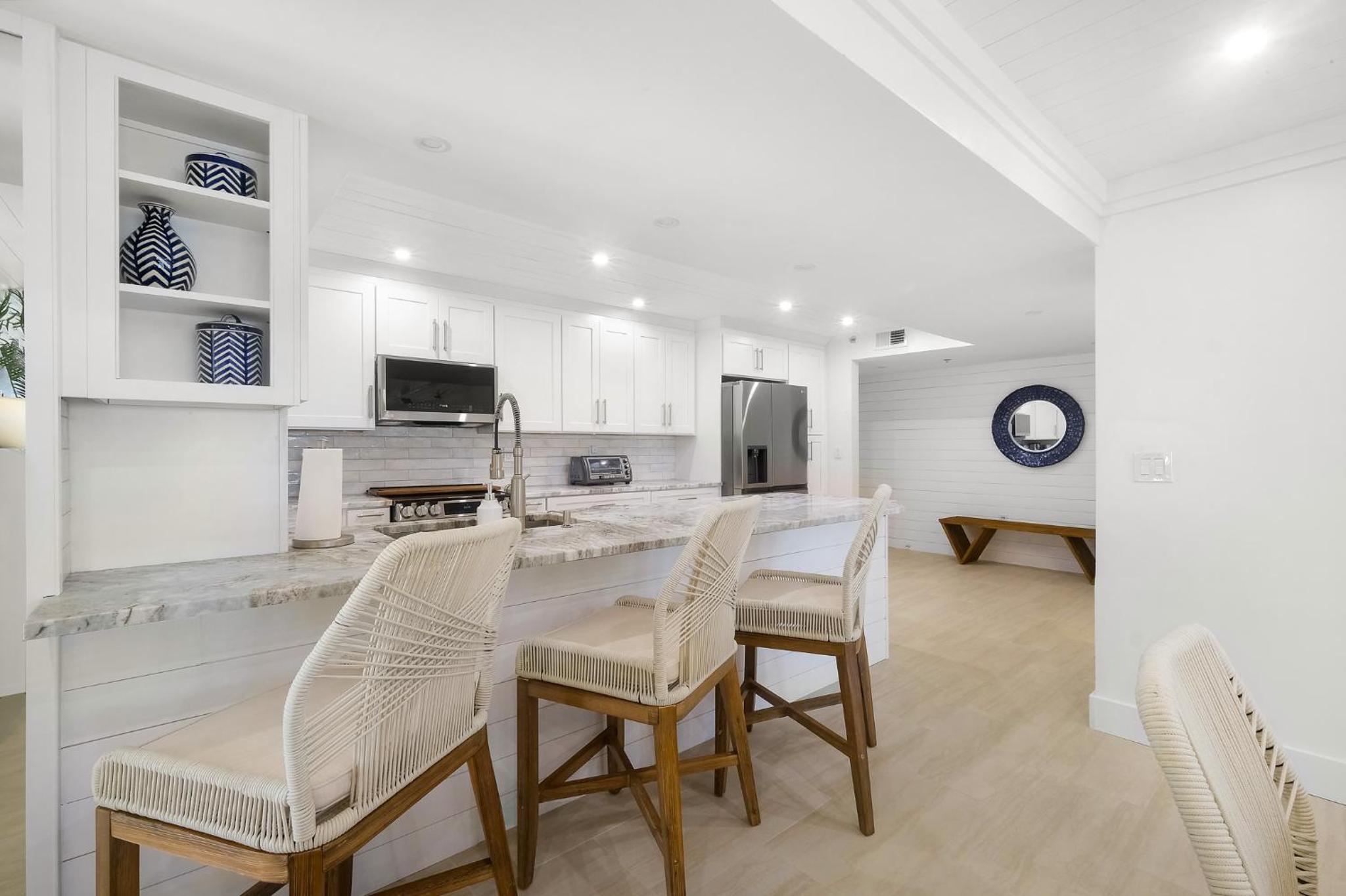 Luxury direct oceanfront corner with large private balcony, heated pool and garage