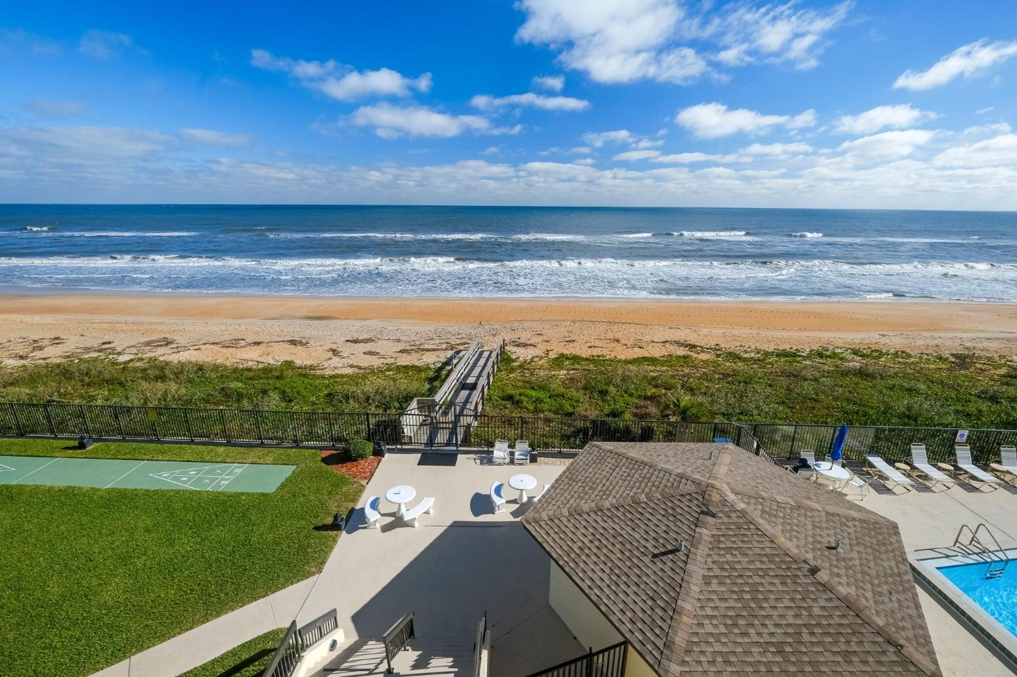 Luxury direct oceanfront corner with large private balcony, heated pool and garage