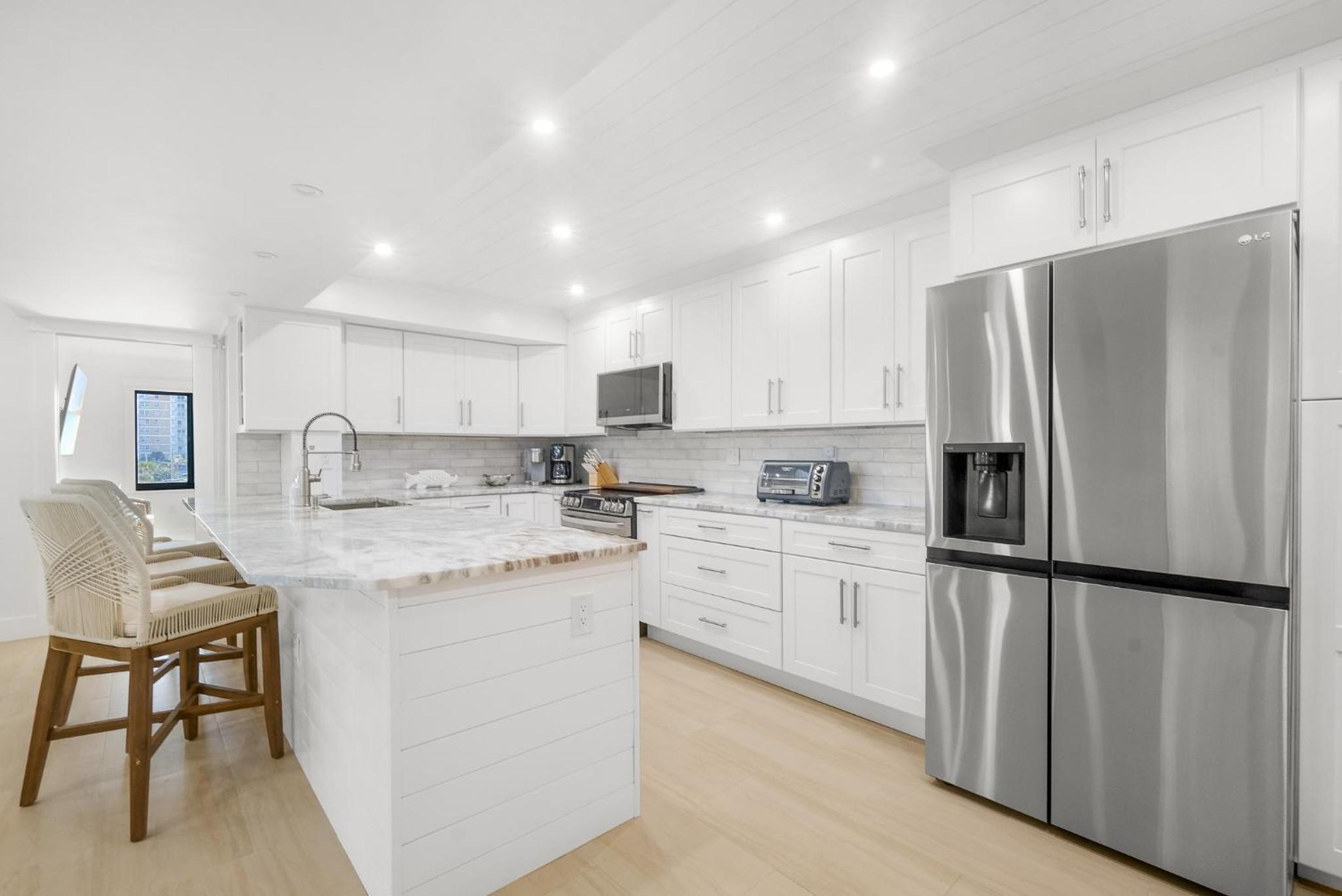 Luxury direct oceanfront corner with large private balcony, heated pool and garage