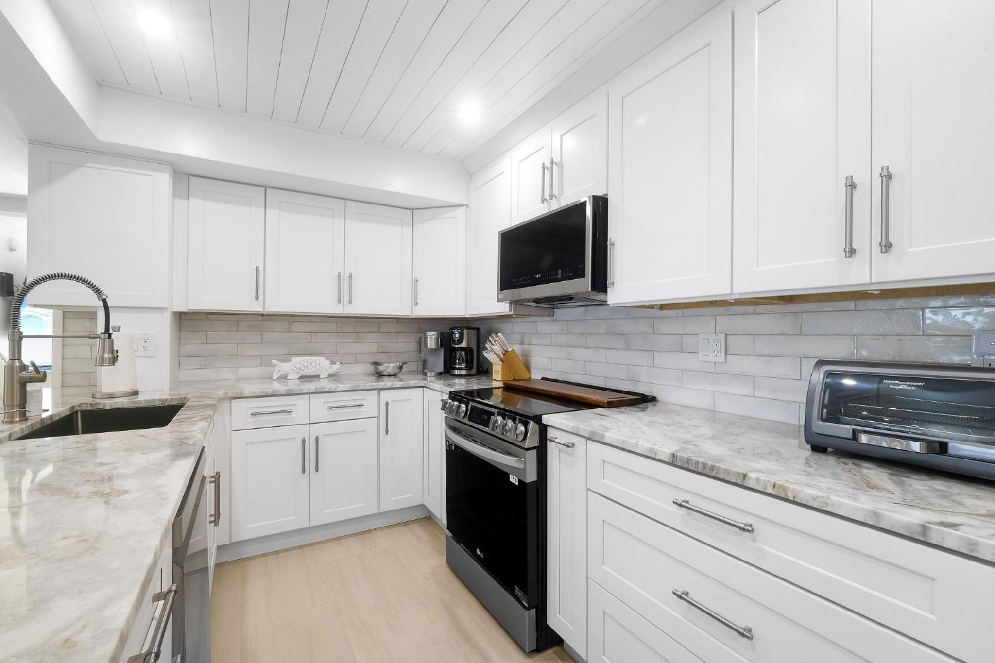 Luxury direct oceanfront corner with large private balcony, heated pool and garage