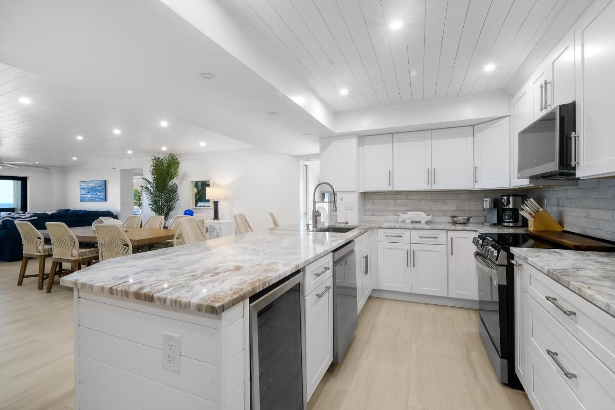 Luxury direct oceanfront corner with large private balcony, heated pool and garage
