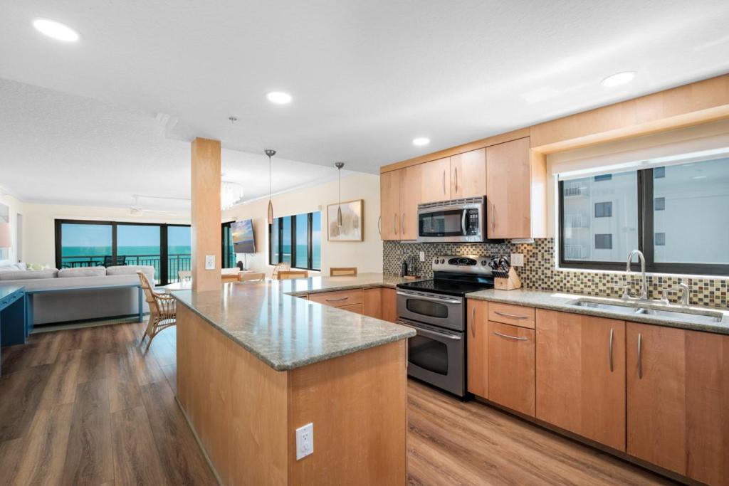Updated direct oceanfront corner condo with large wrap-around balcony and heated pool