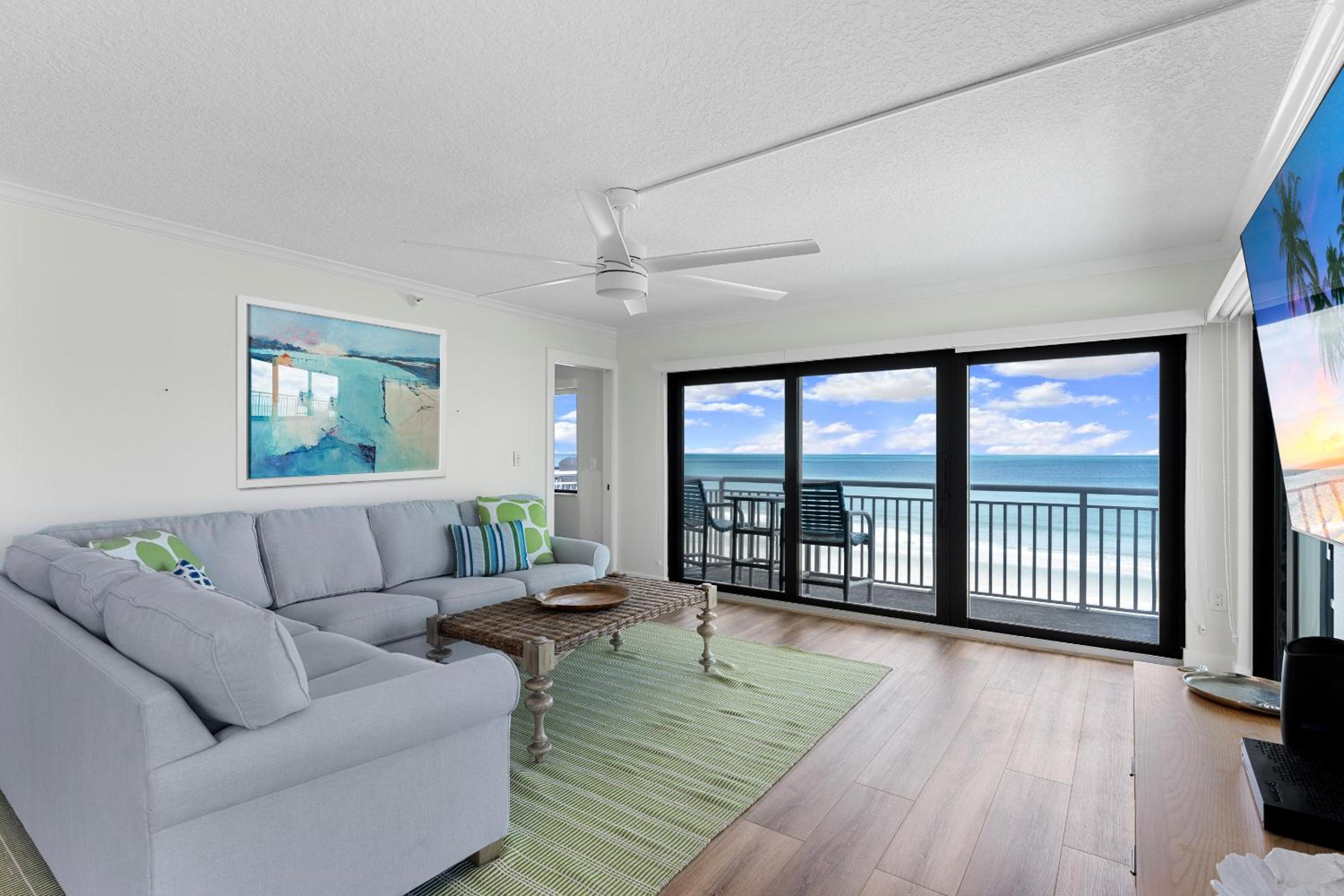 Updated direct oceanfront corner condo with large wrap-around balcony and heated pool