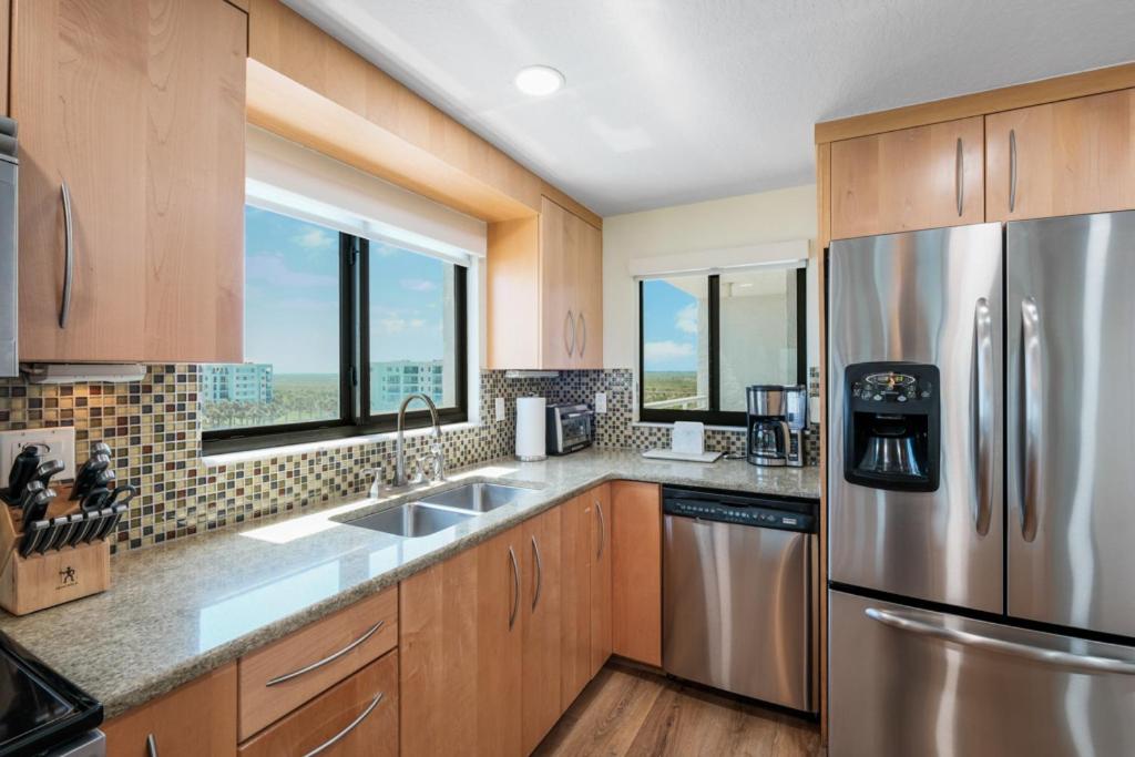 Updated direct oceanfront corner condo with large wrap-around balcony and heated pool