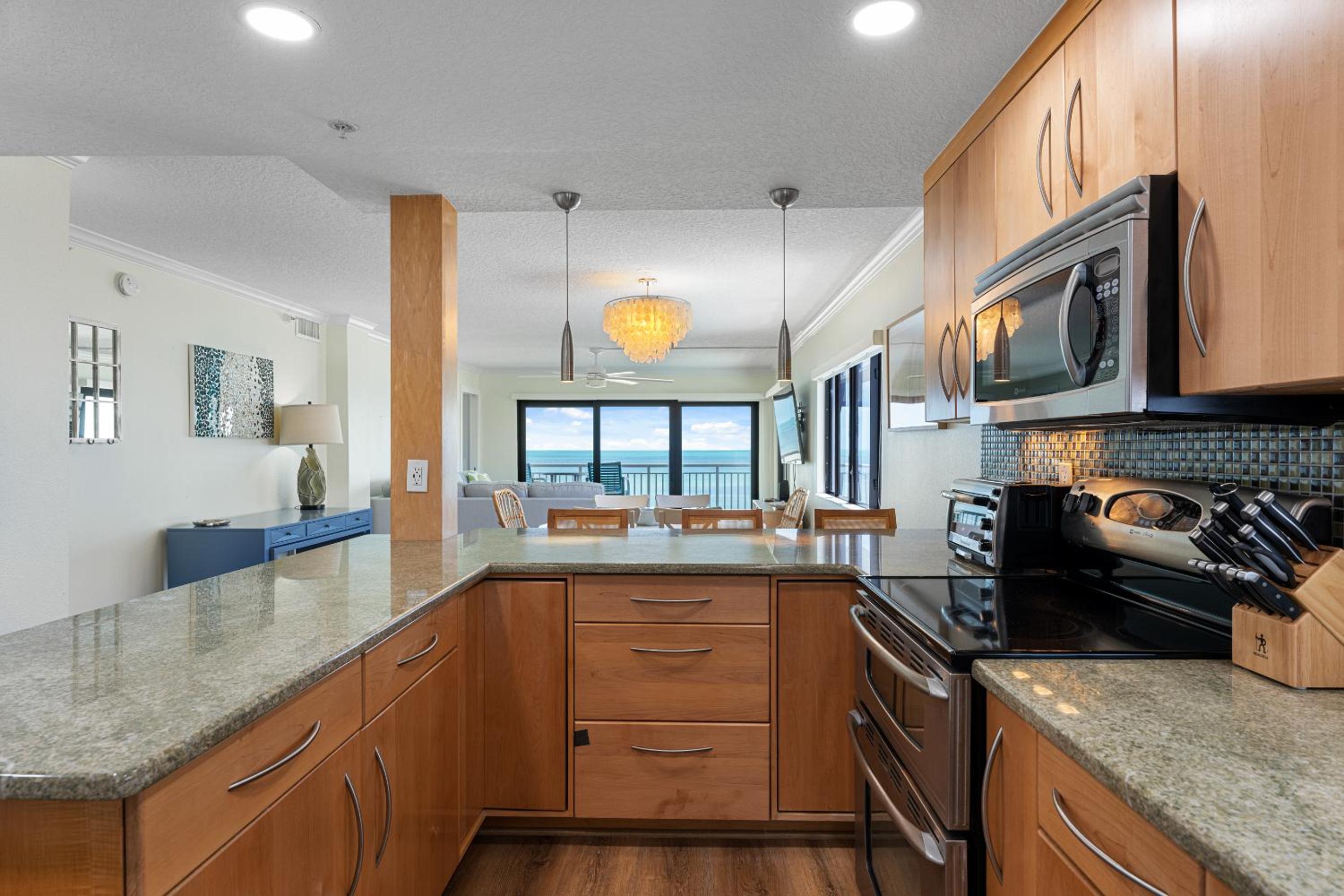 Updated direct oceanfront corner condo with large wrap-around balcony and heated pool